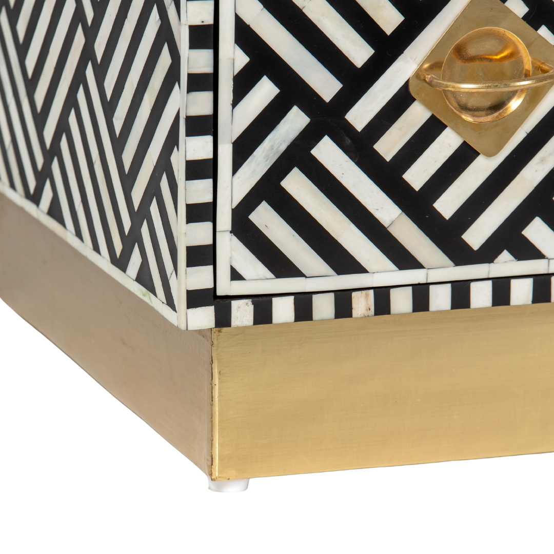 Luxury black and white bone inlay chest of drawers with brass accents and geometric design, handcrafted for statement interiors.