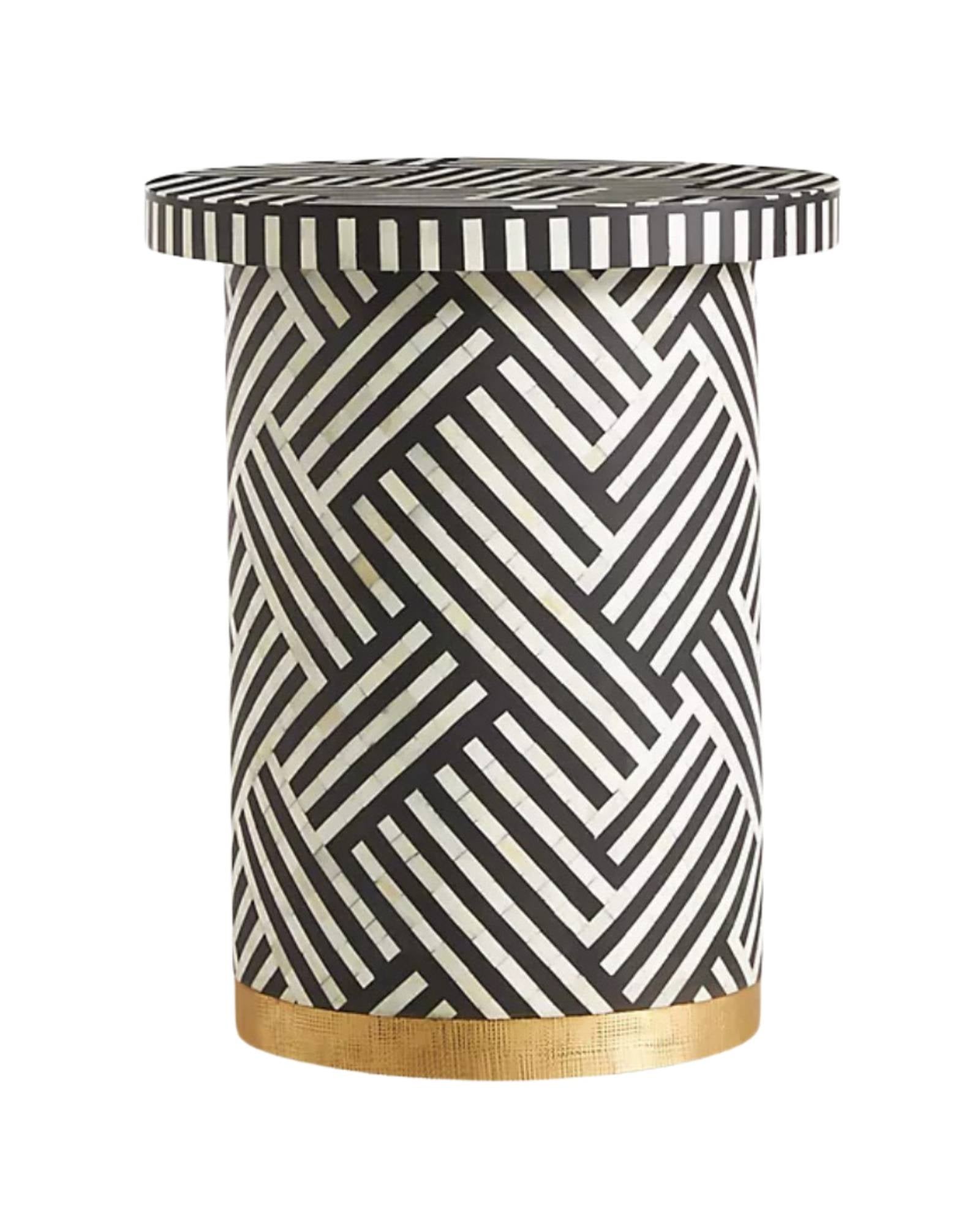 Black bone inlay side table with bold striped pattern, handcrafted with a brass base accent, ideal for modern interiors.