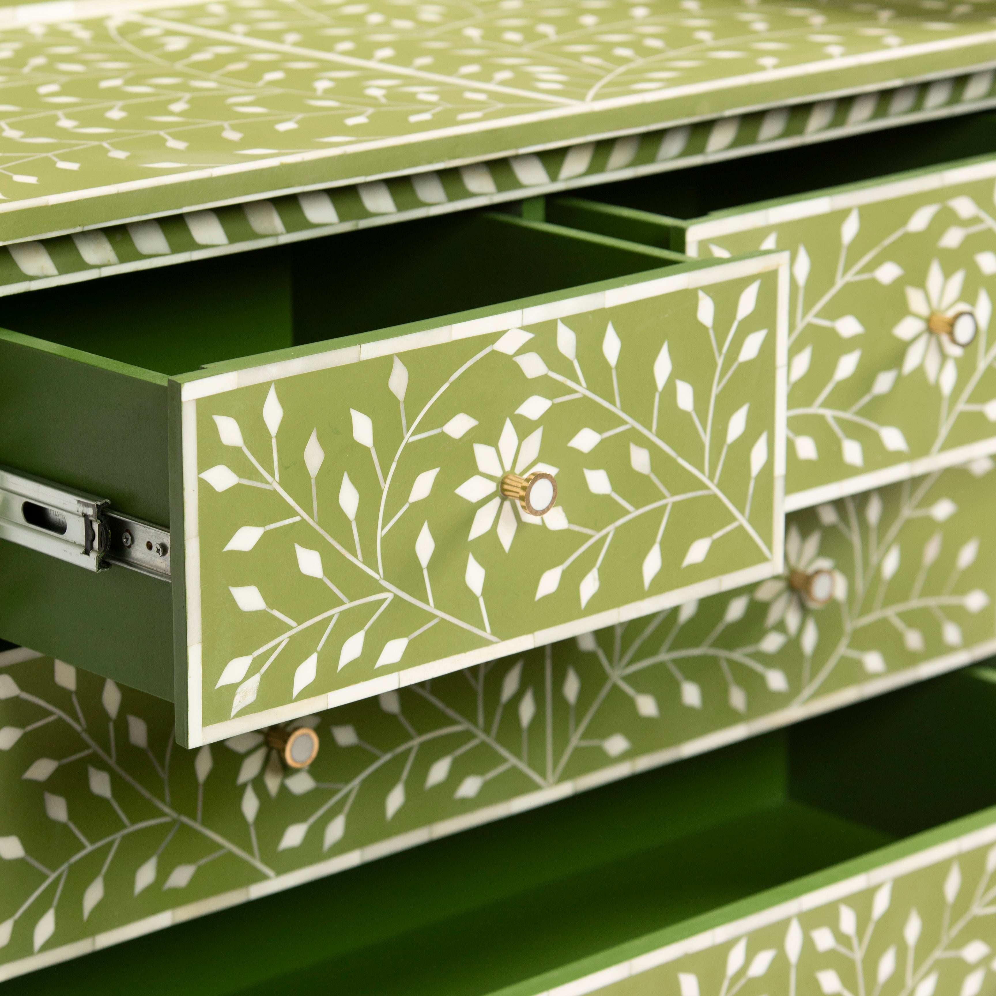 Bone inlay chest of drawers featuring intricate floral vine pattern in green and white, handcrafted furniture piece