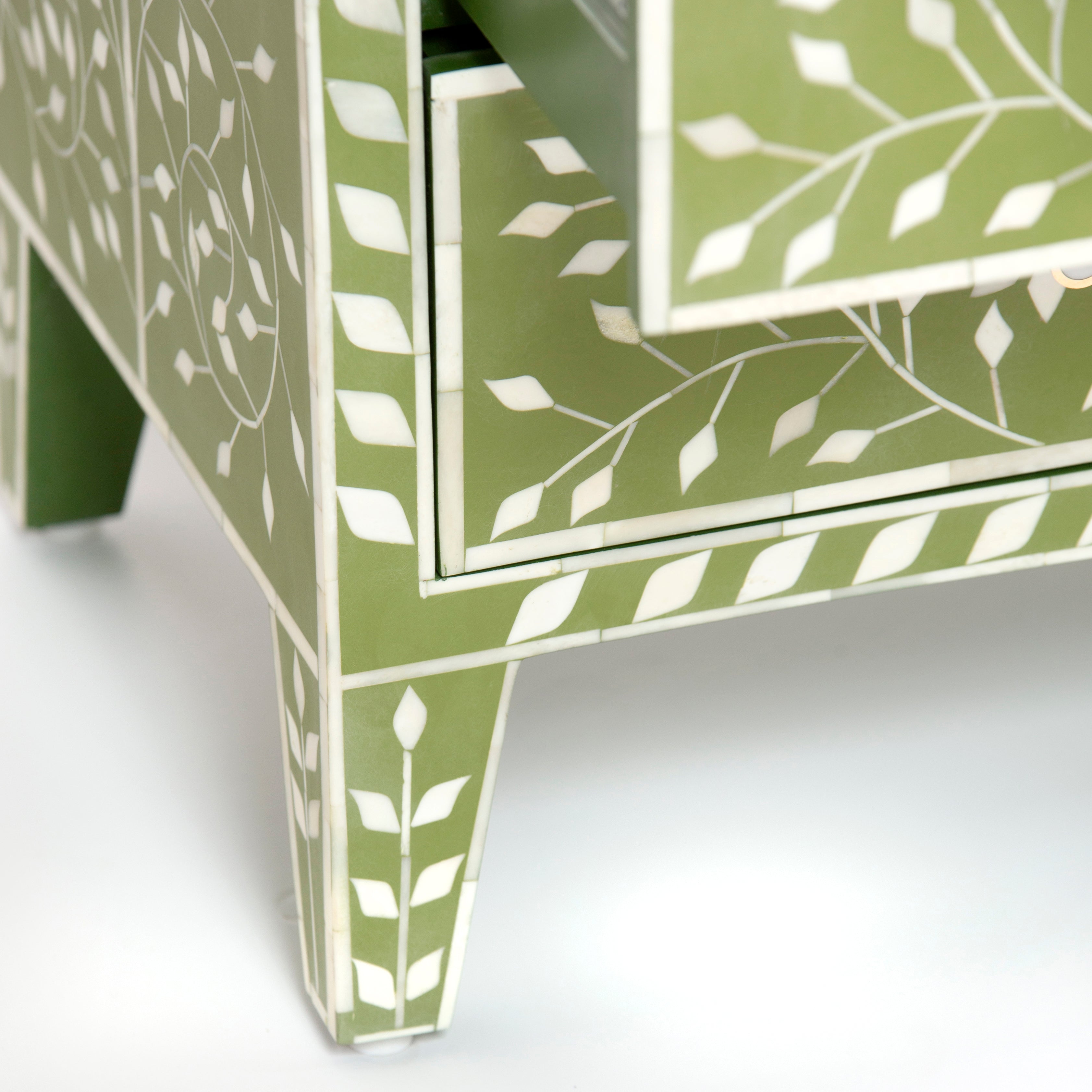 Bone inlay chest of drawers featuring intricate floral vine pattern in green and white, handcrafted furniture piece