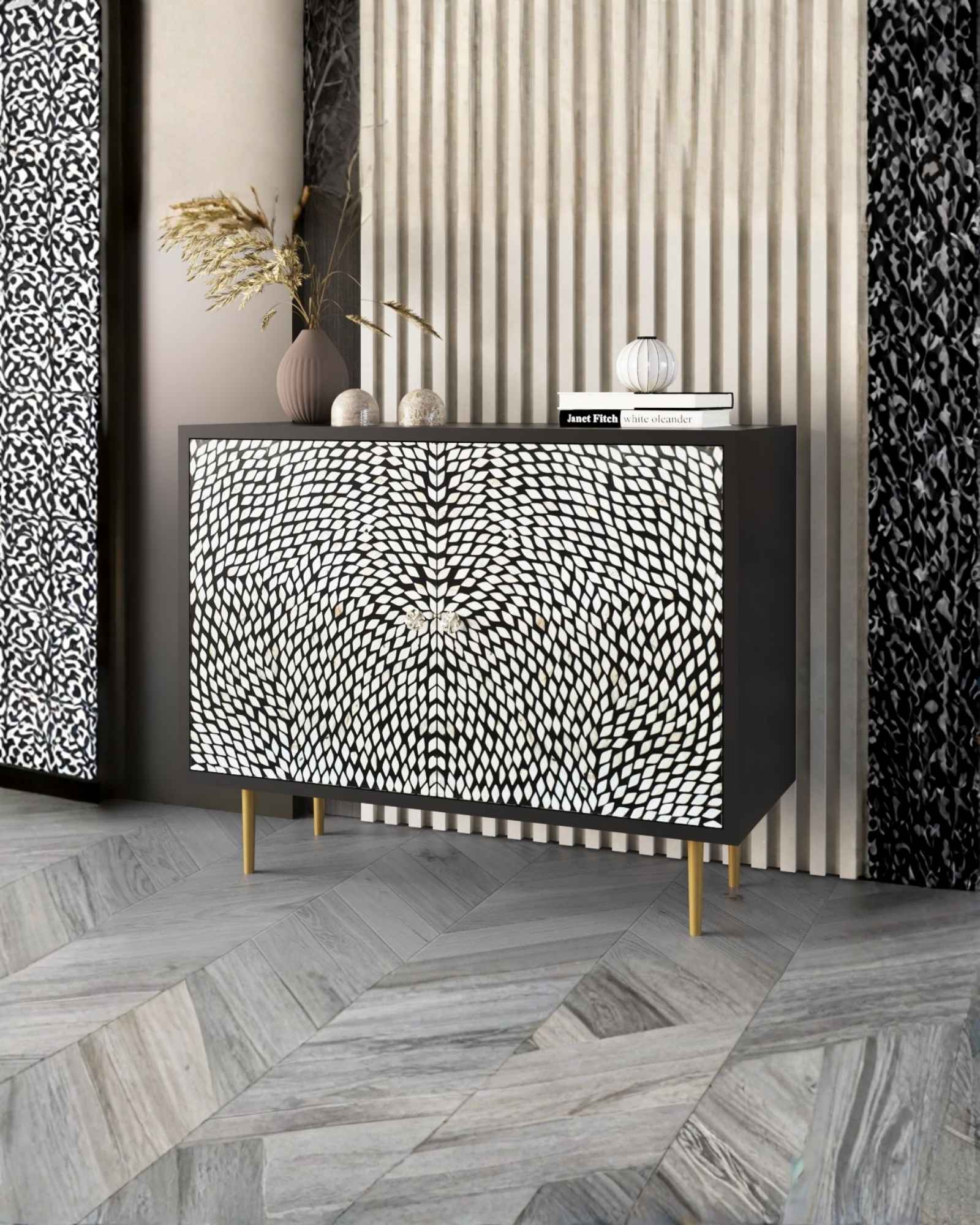 Handcrafted Black |& White Cabinet with intricate Mother of Pearl inlay, featuring a floral pattern and sleek Metal legs. A luxurious storage solution for any space.