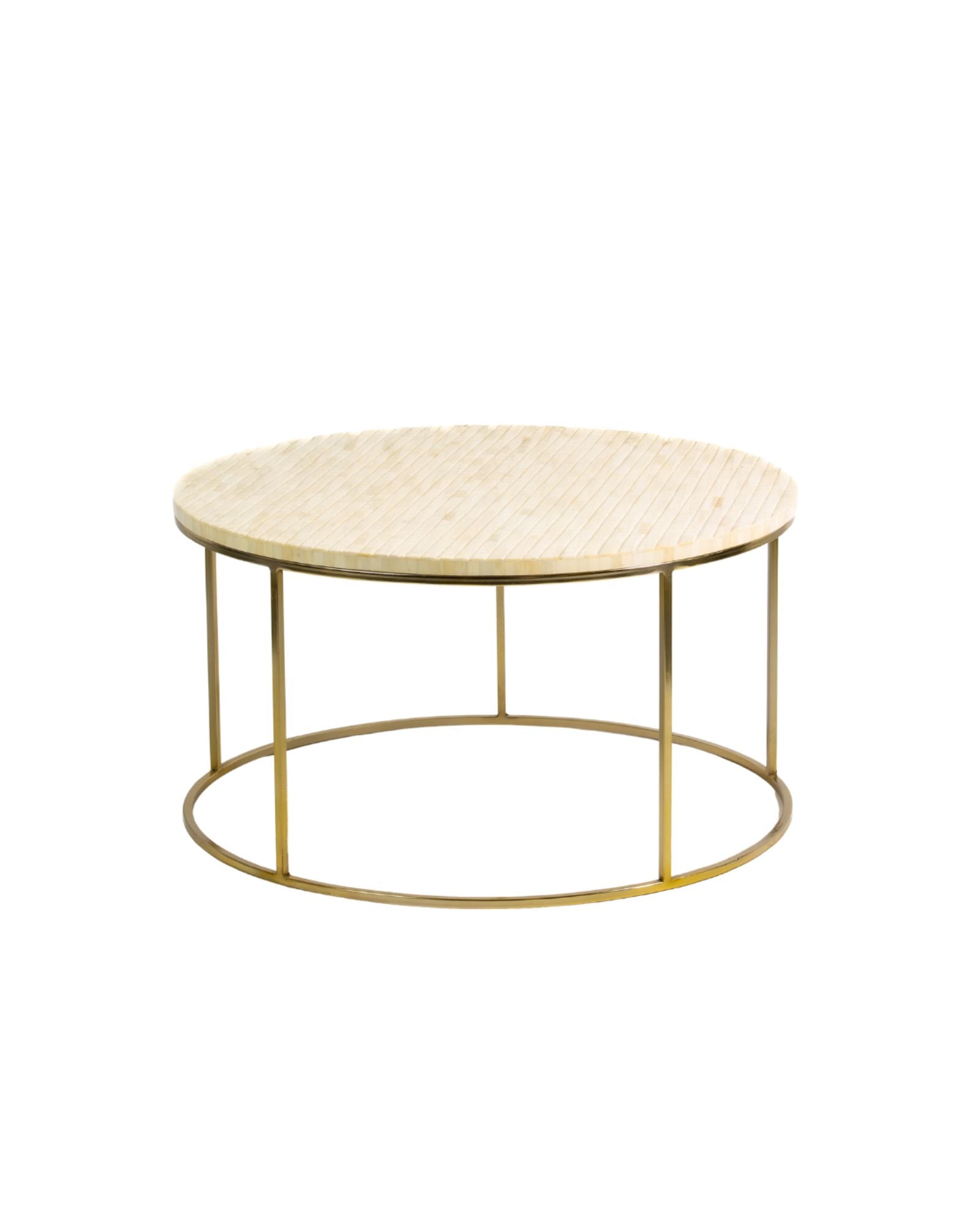 Ivory bone carved coffee table with linear textured design and brushed gold circular metal base by Tabeer Homes.