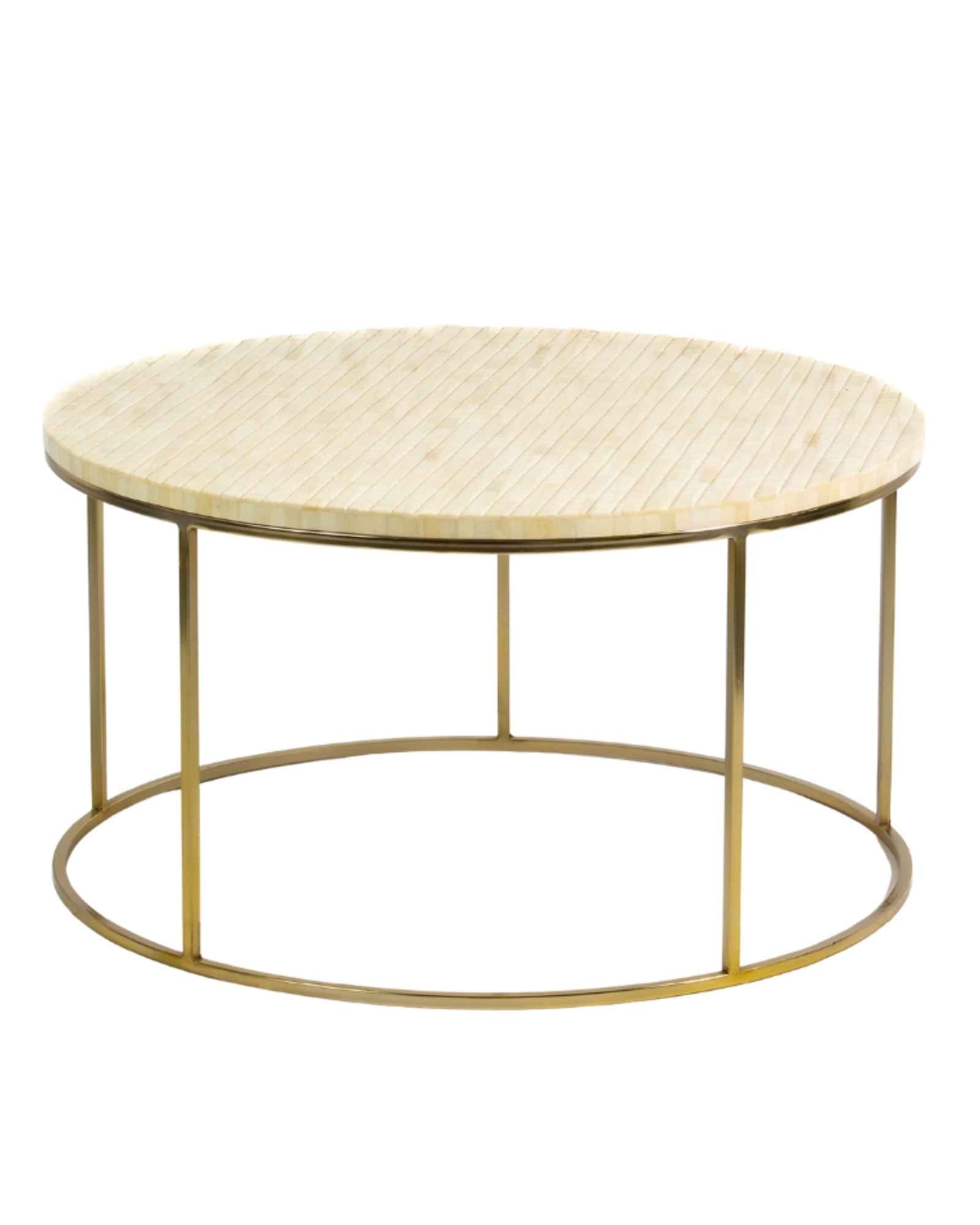 Ivory bone carved coffee table with linear textured design and brushed gold circular metal base by Tabeer Homes.