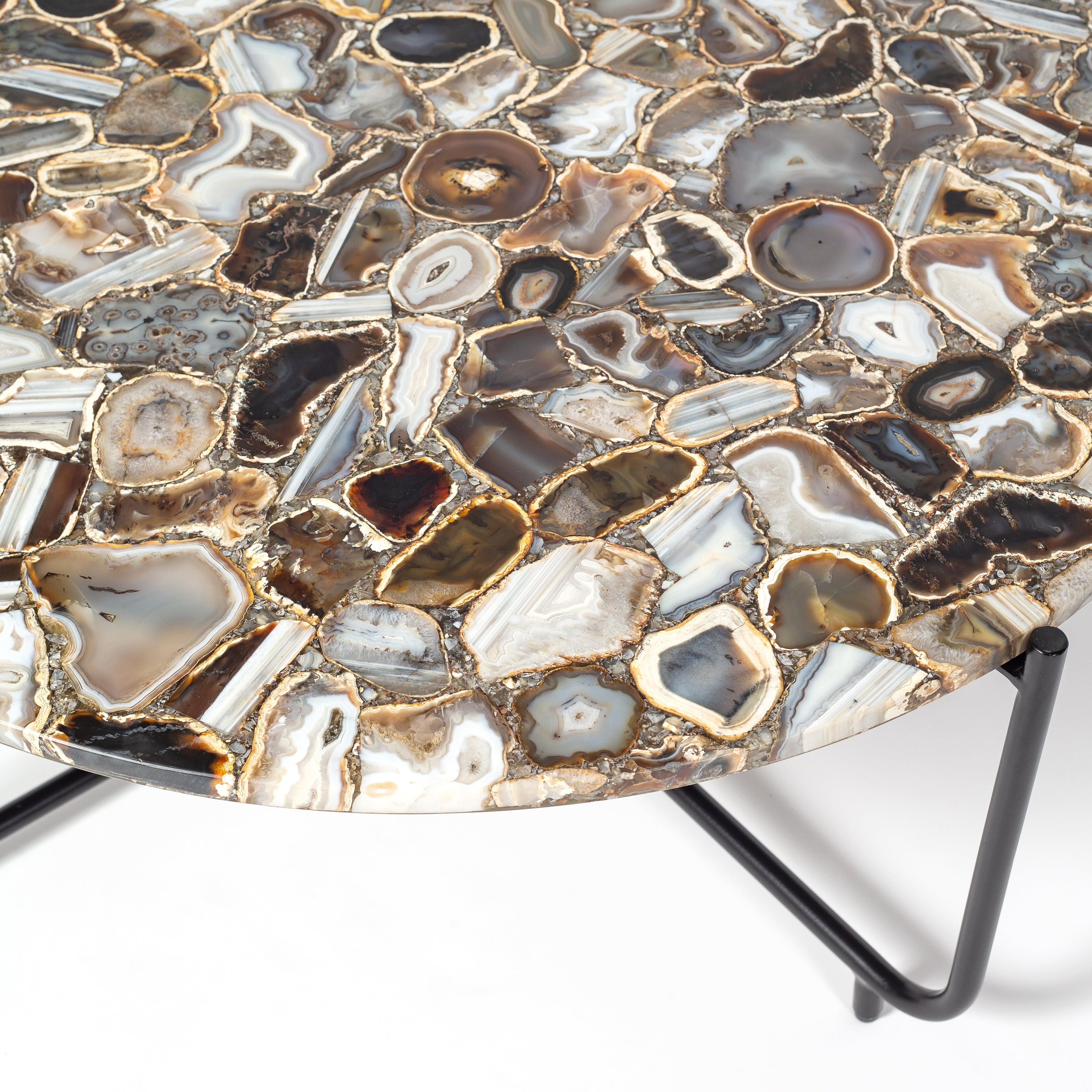 Round coffee table with genuine agate stone top and sleek black metal base, modern and luxurious centerpiece design.