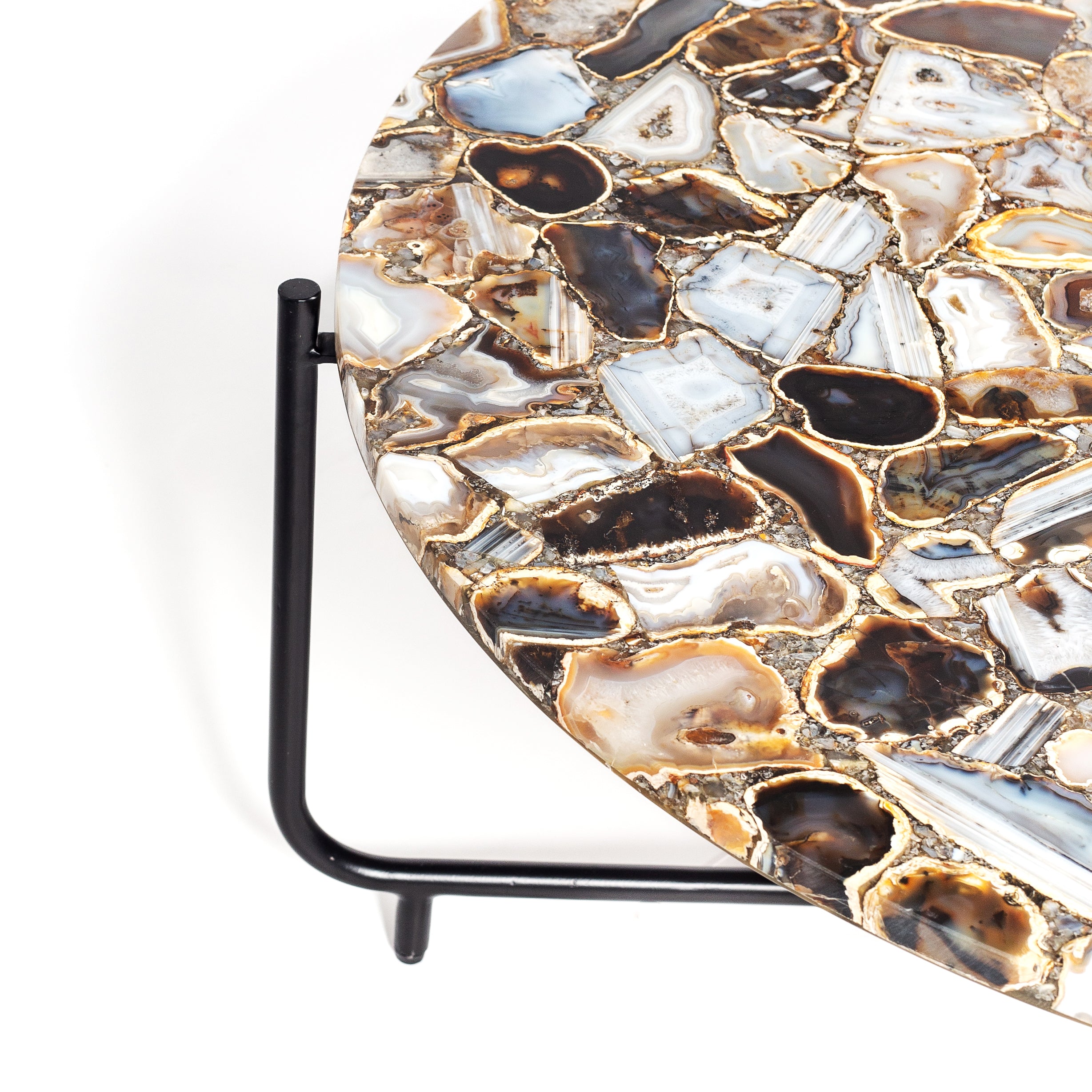 Round coffee table with genuine agate stone top and sleek black metal base, modern and luxurious centerpiece design.