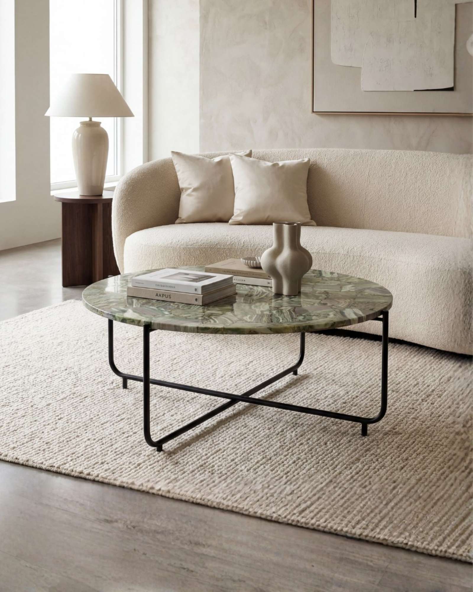 Handcrafted agate coffee table with round stone top and black metal base, artisan-made heritage piece.