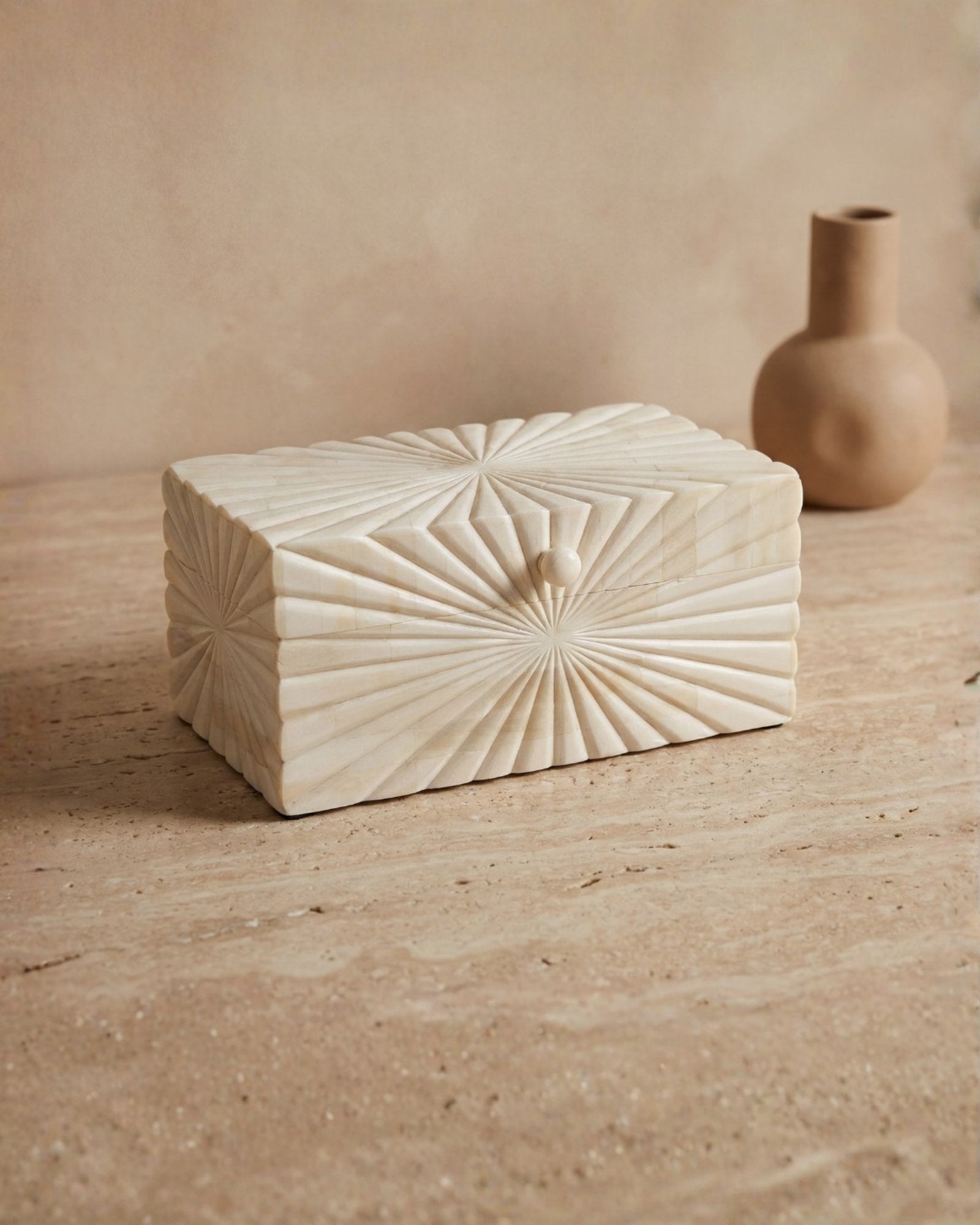 Hand carved bone decorative box with radial geometric pattern, handcrafted storage box in natural ivory finish.