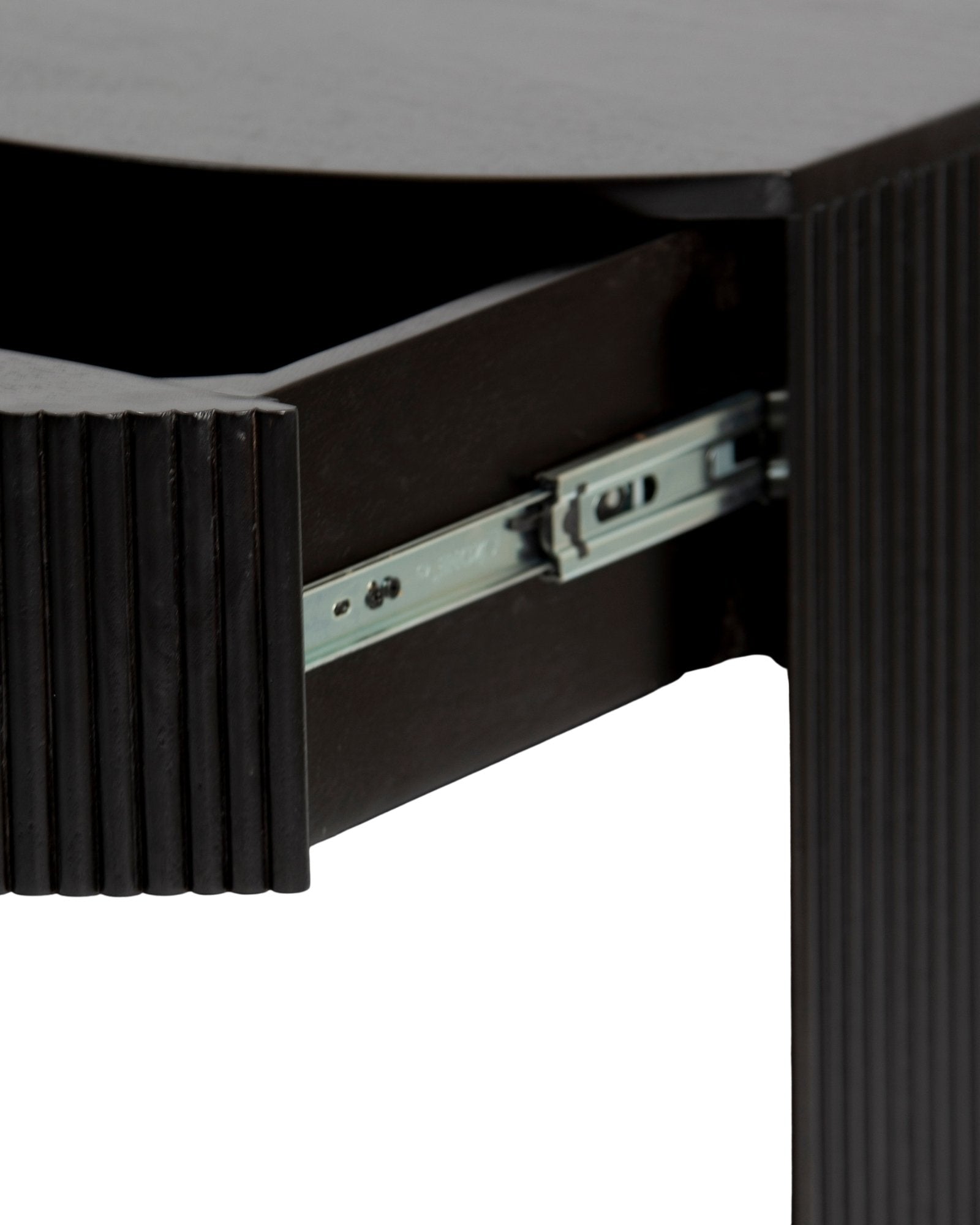 Wooden side drawer featuring fluted texture in black with brass accents, handcrafted furniture piece.