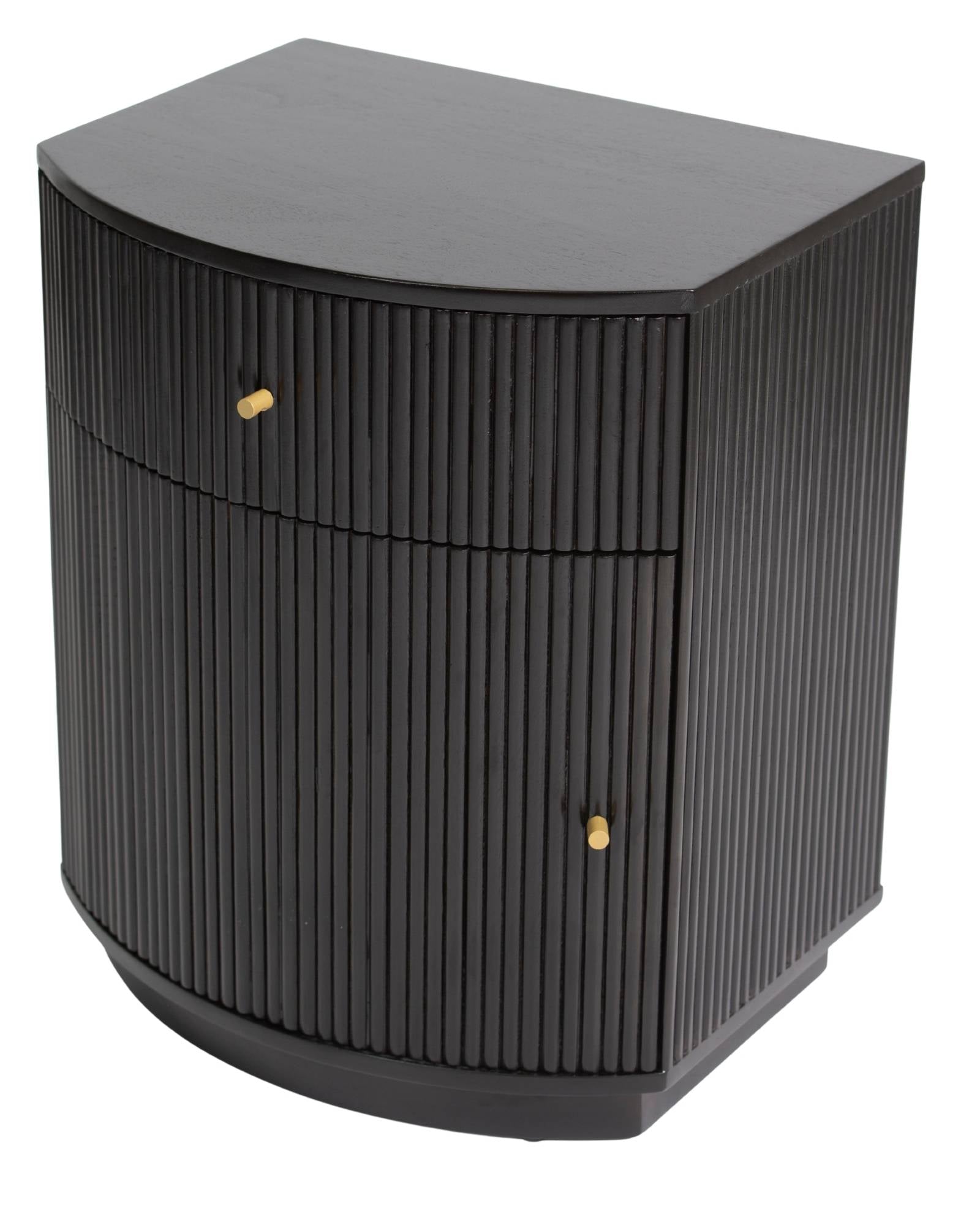 Wooden side drawer featuring fluted texture in black with brass accents, handcrafted furniture piece.