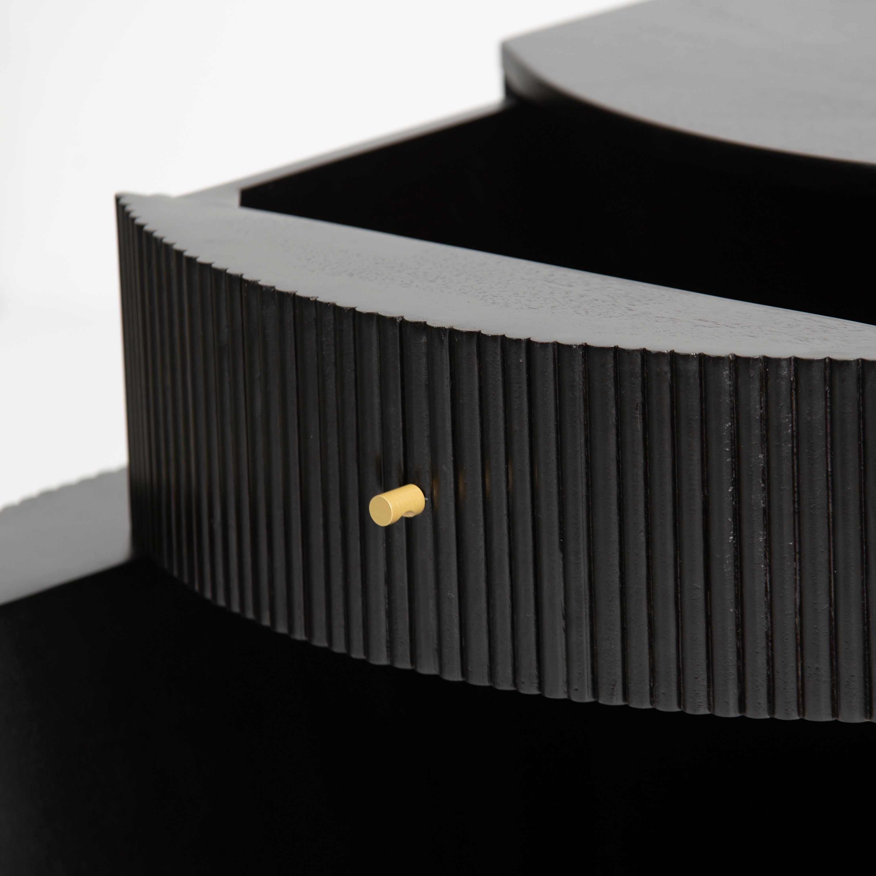 Wooden side drawer featuring fluted texture in black with brass accents, handcrafted furniture piece