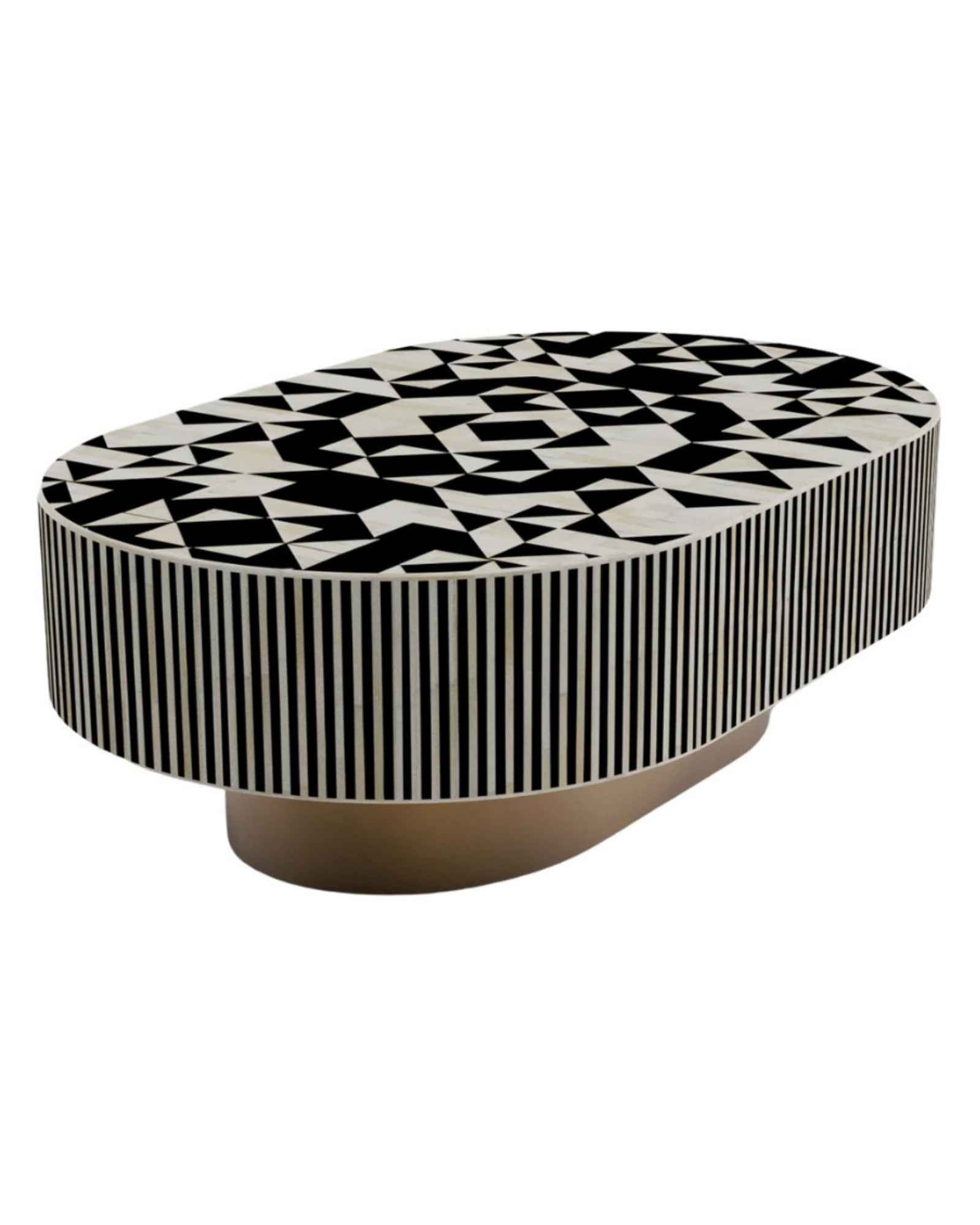 Black and white bone inlay coffee table with geometric pattern and gold base in contemporary setting.