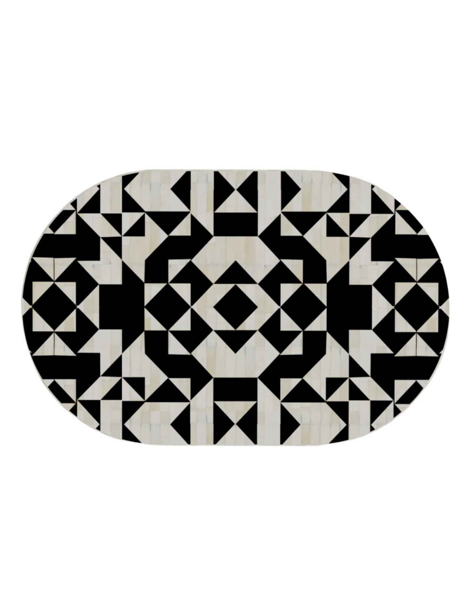 Black and white bone inlay coffee table with geometric pattern and gold base in contemporary setting.