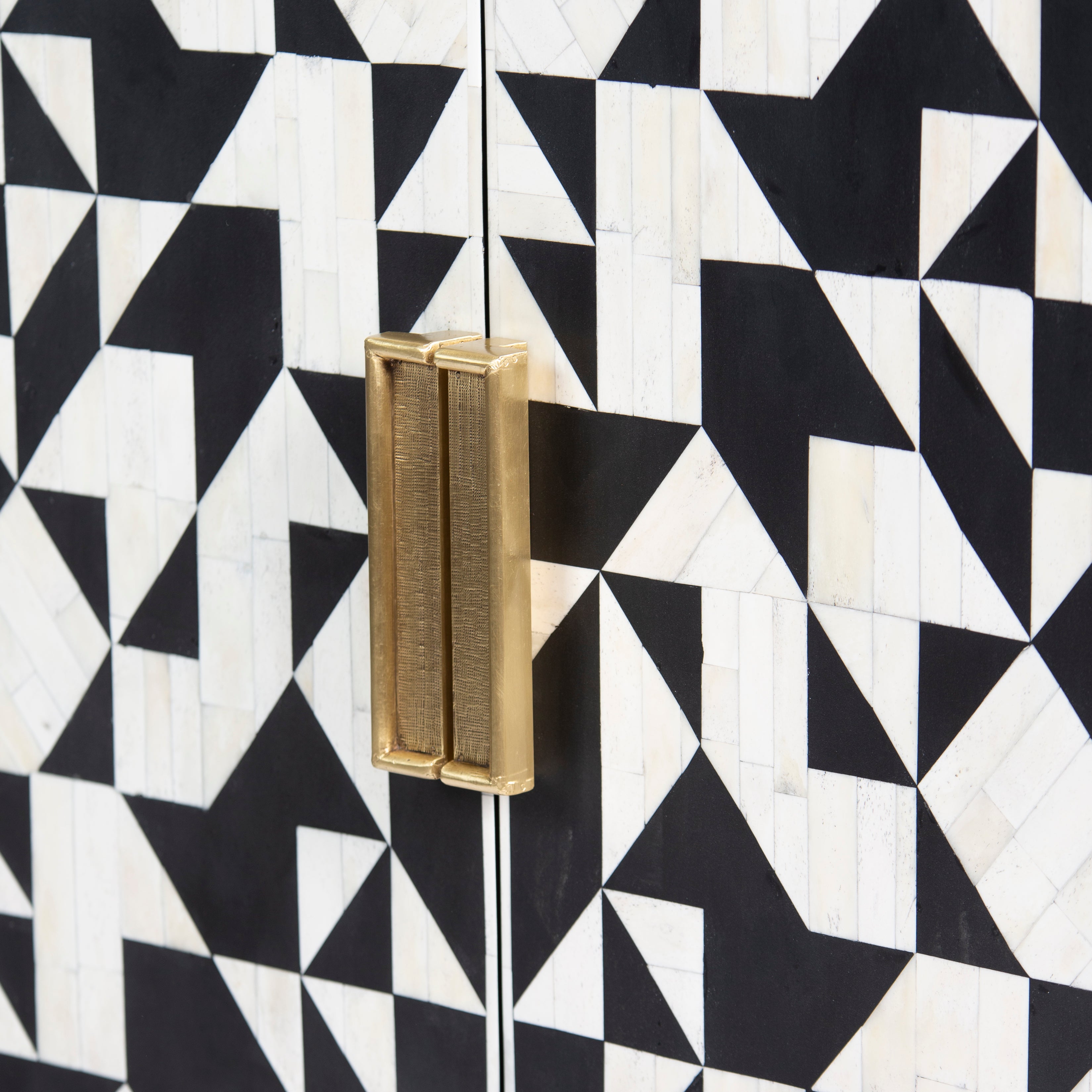 Bone inlay cabinet featuring geometric pattern in black and white with metal base, handcrafted furniture piece