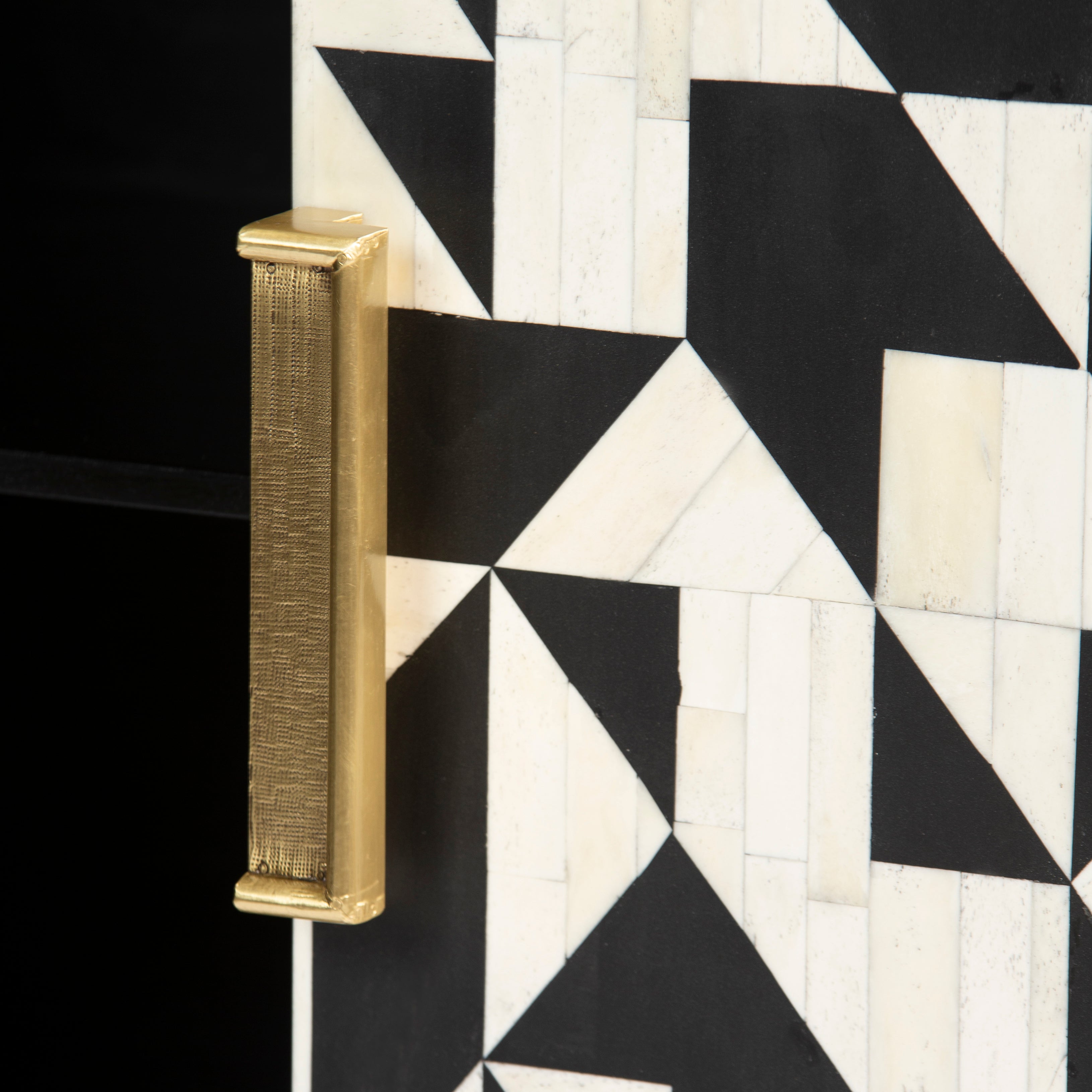 Bone inlay cabinet featuring geometric pattern in black and white with metal base, handcrafted furniture piece