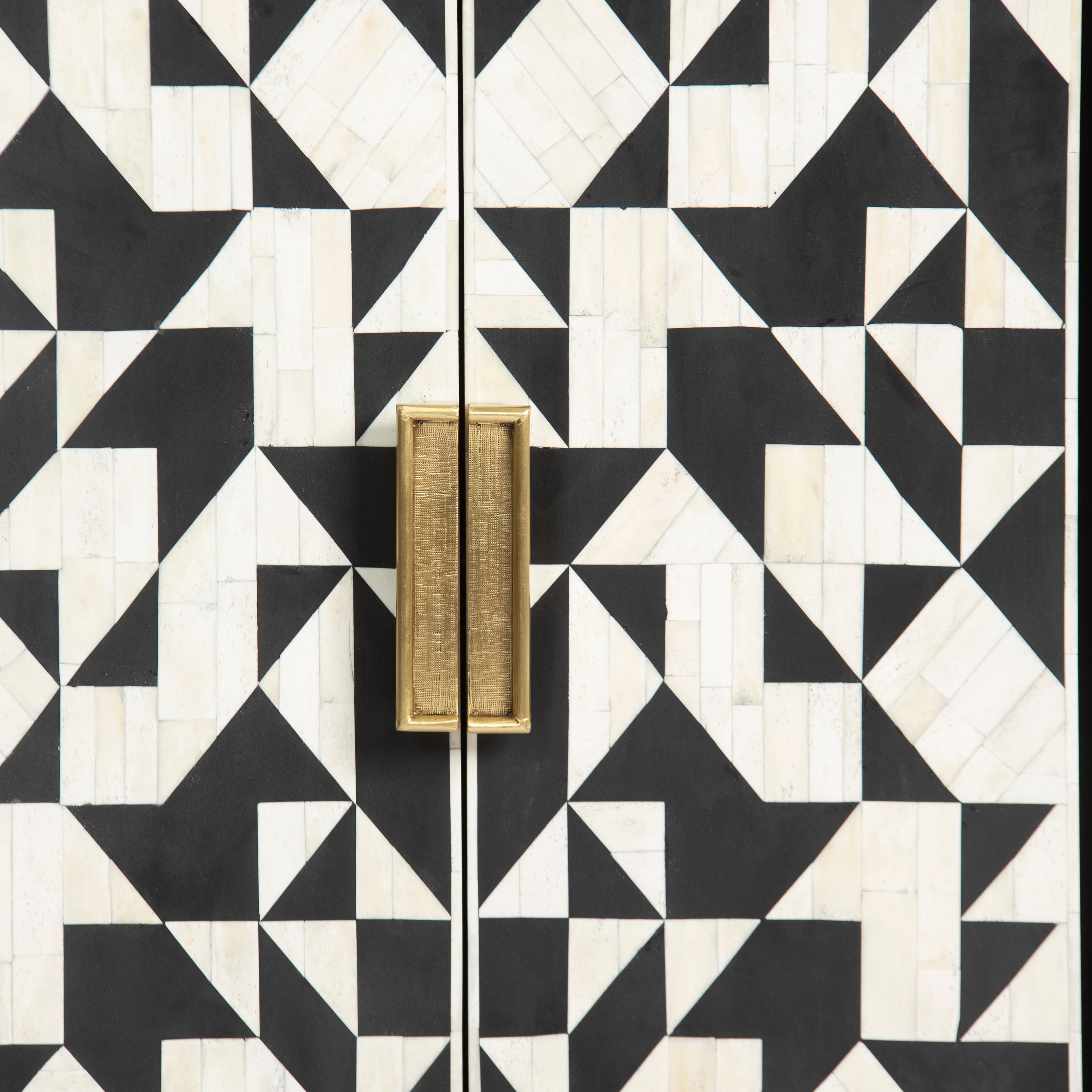 Bone inlay cabinet featuring geometric pattern in black and white with metal base, handcrafted furniture piece