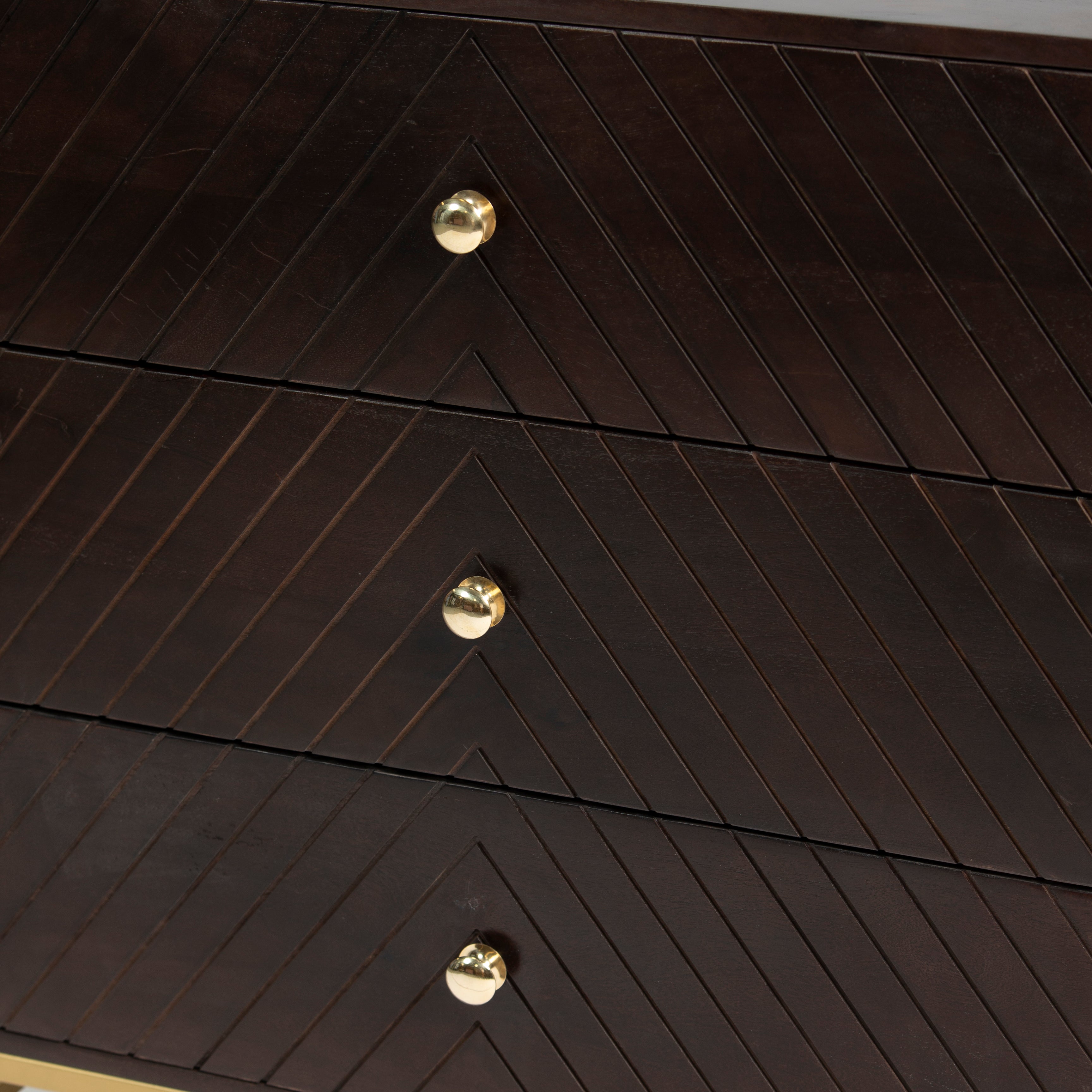 Wooden chest of drawers featuring chevron pattern in brown with brass accents, handcrafted furniture piece