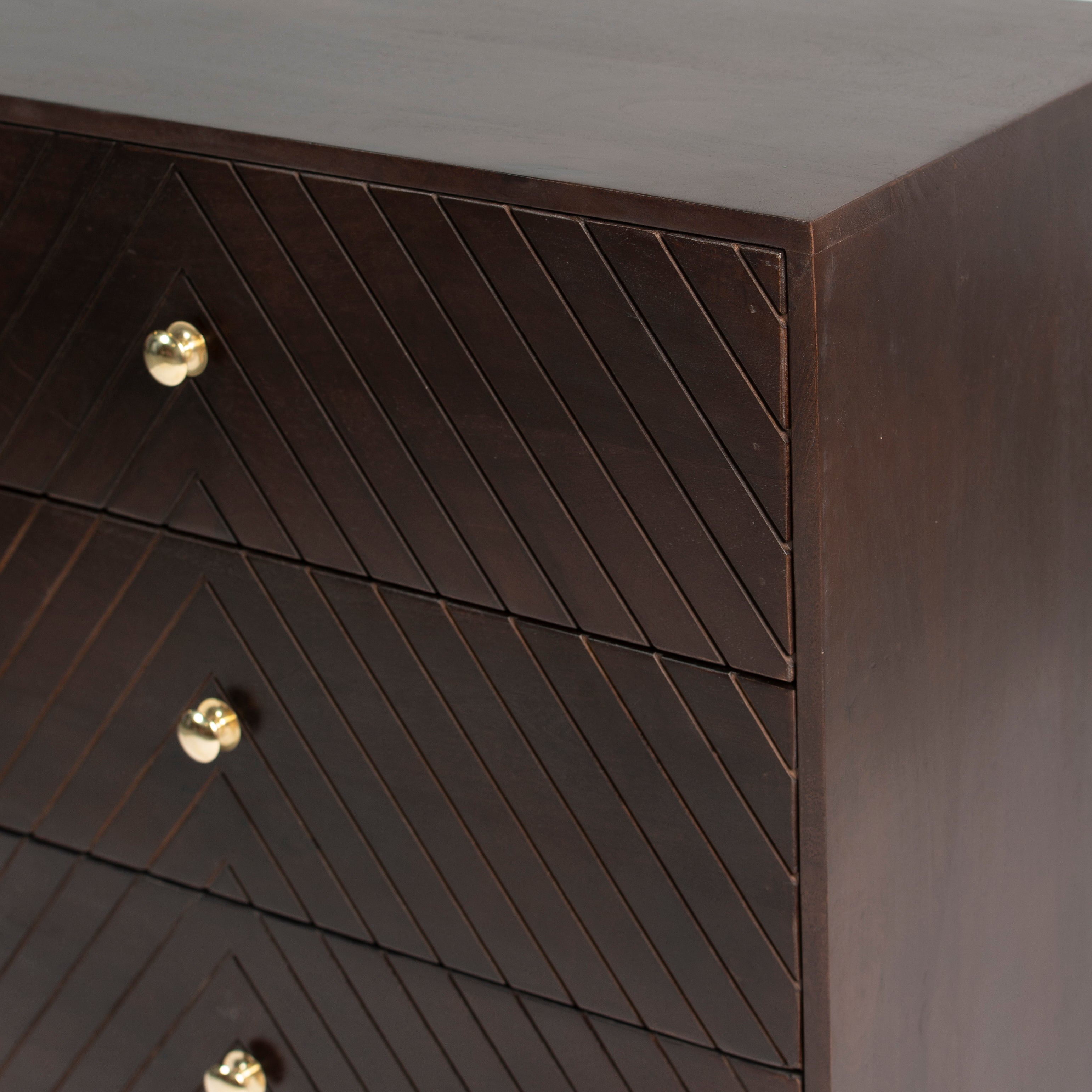 Wooden chest of drawers featuring chevron pattern in brown with brass accents, handcrafted furniture piece