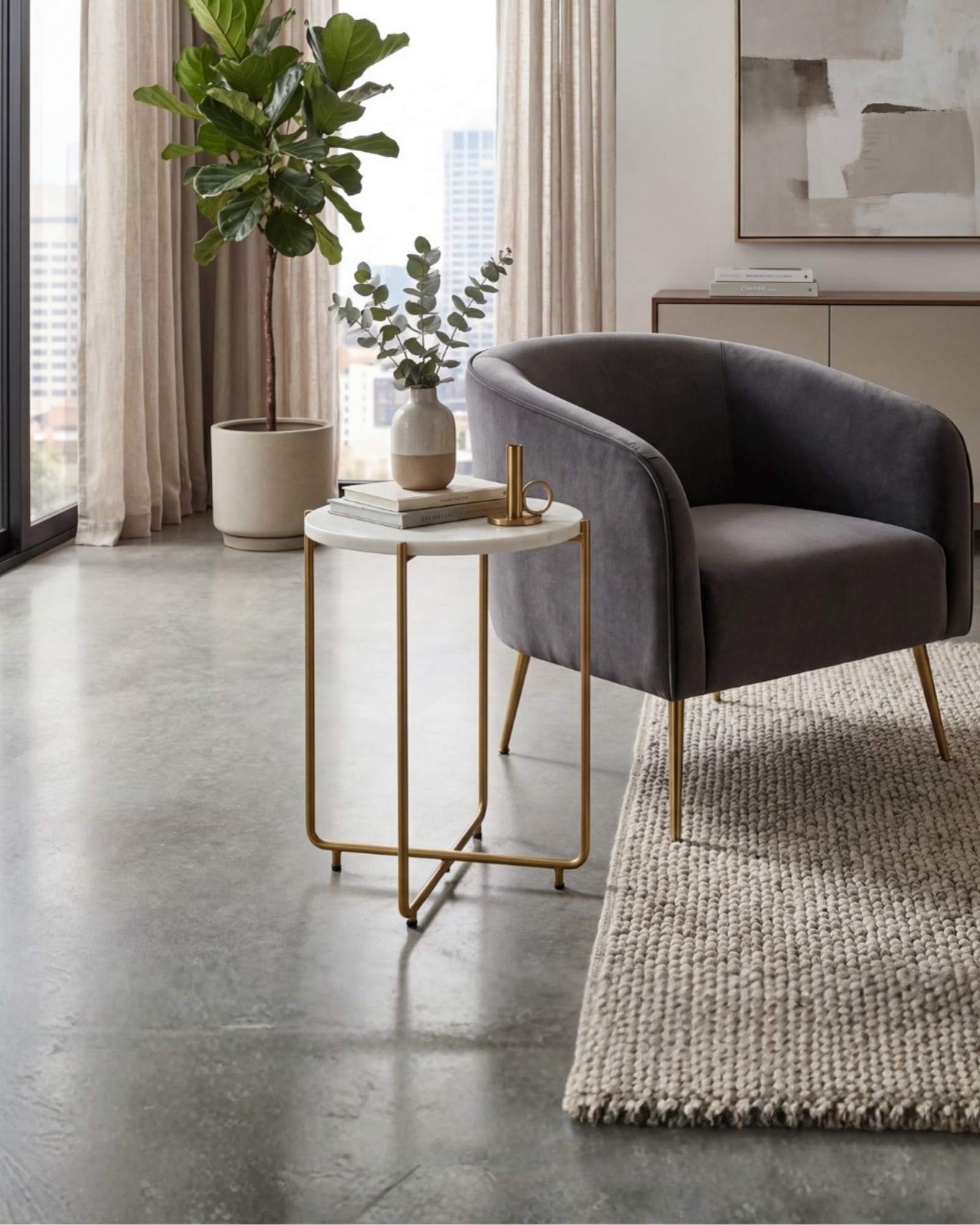 Marble side table featuring round white top with brass metal base, handcrafted furniture piece.