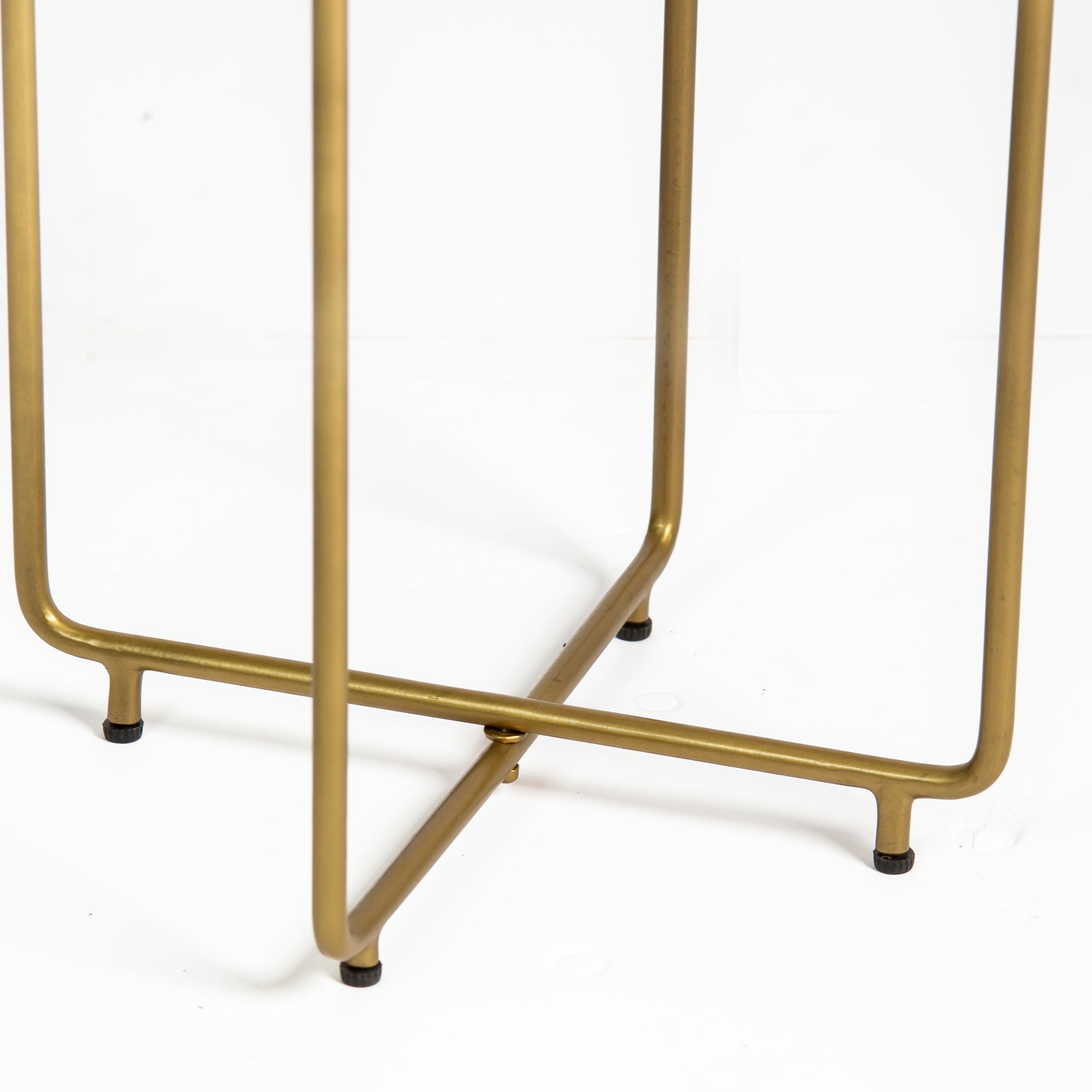 Marble side table featuring round white top with brass metal base, handcrafted furniture piece