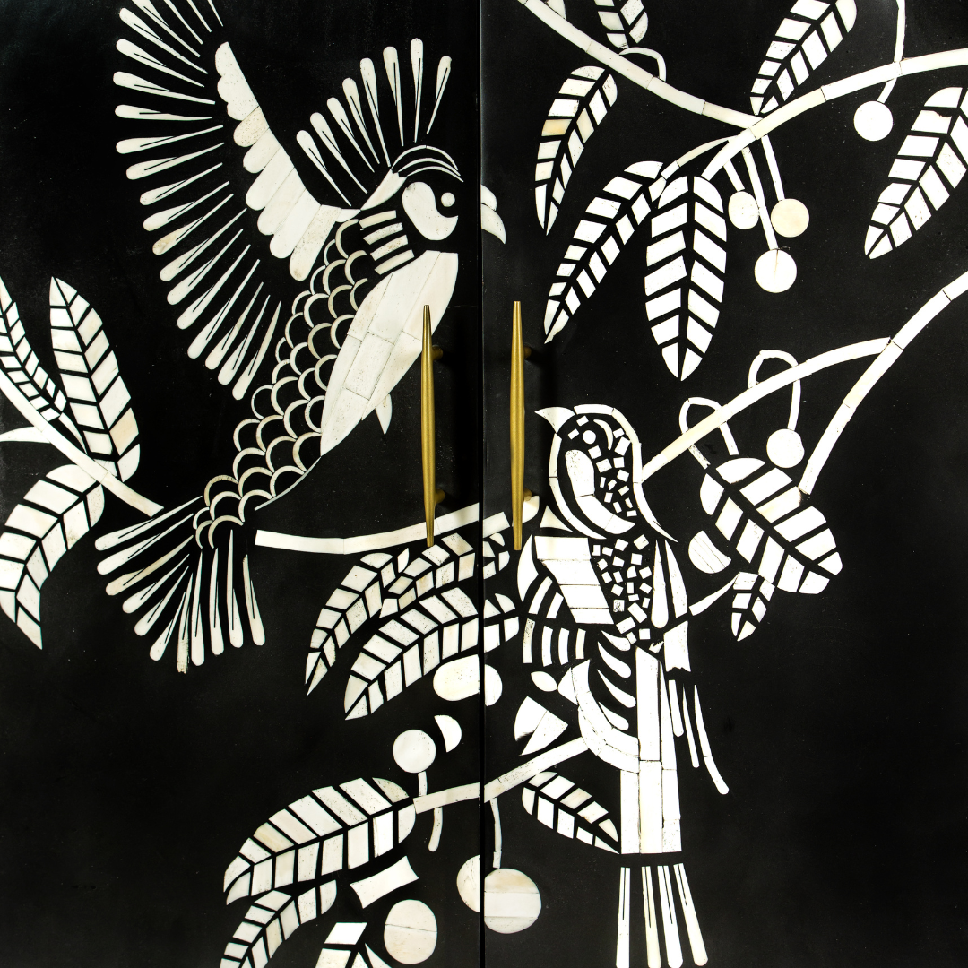Handcrafted white bone inlay cabinet by Tabeer Homes, featuring bird and leaf motifs on mango wood with brass handles and global delivery.