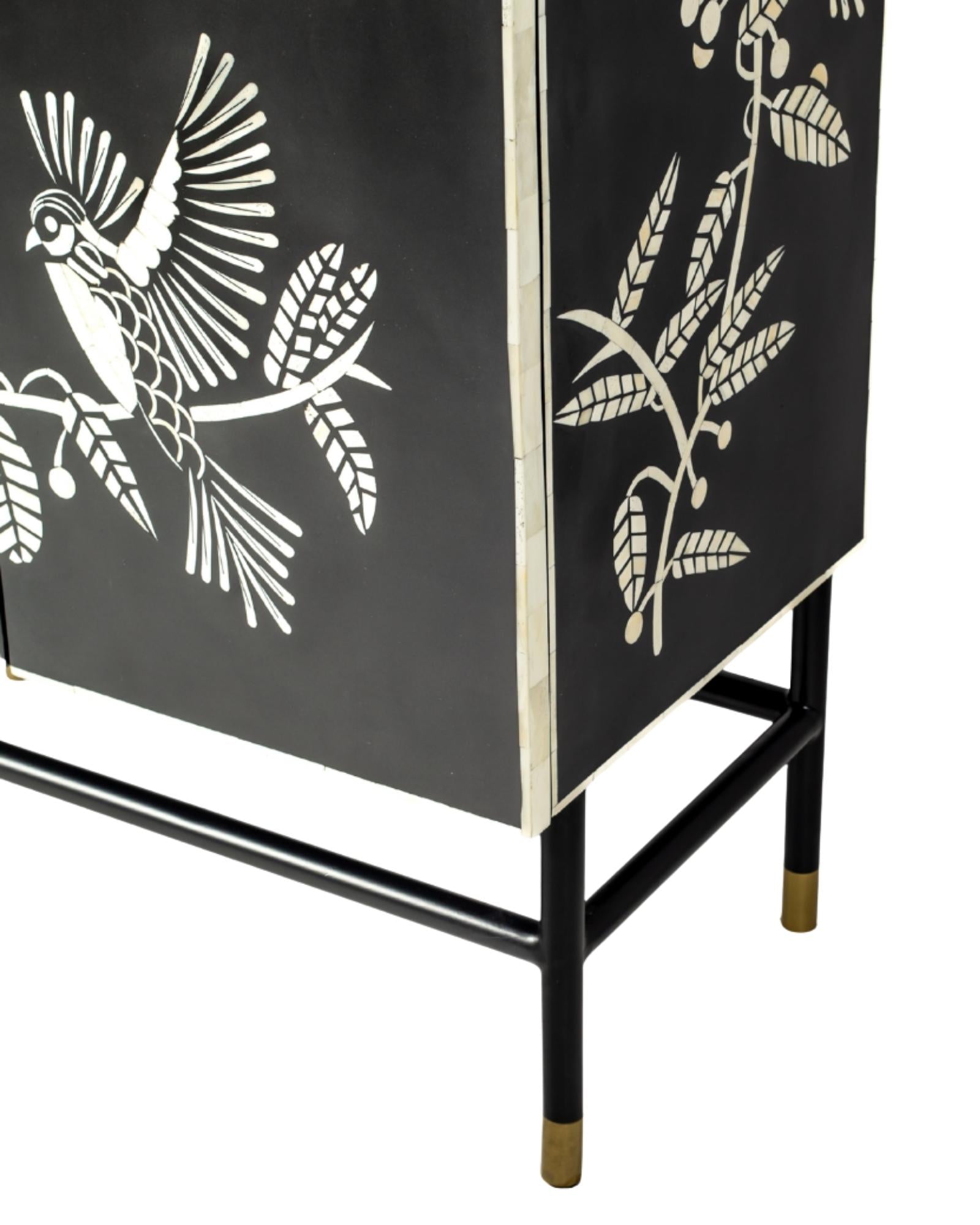 Handcrafted white bone inlay cabinet by Tabeer Homes, featuring bird and leaf motifs on mango wood with brass handles and global delivery.