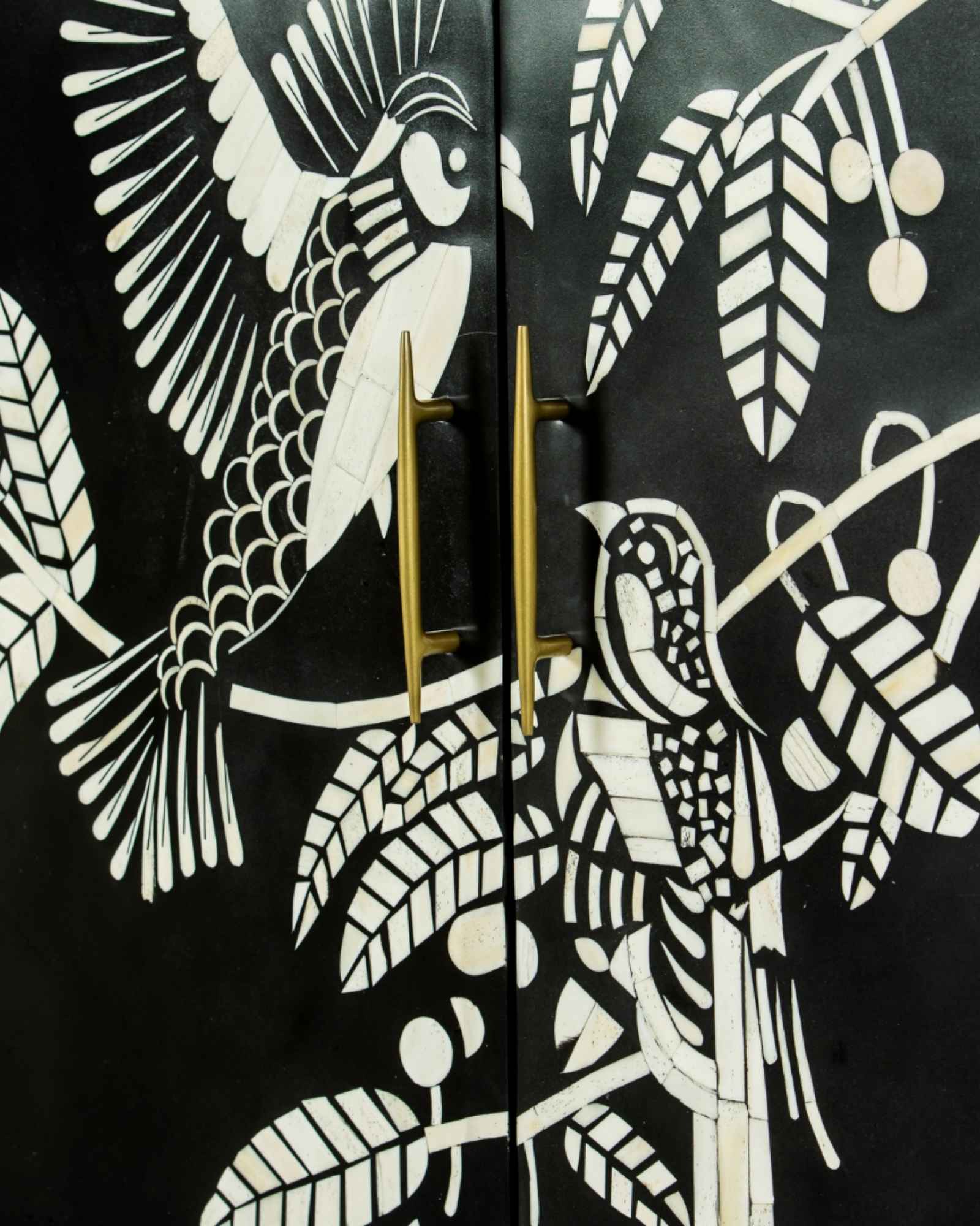 Handcrafted white bone inlay cabinet by Tabeer Homes, featuring bird and leaf motifs on mango wood with brass handles and global delivery.