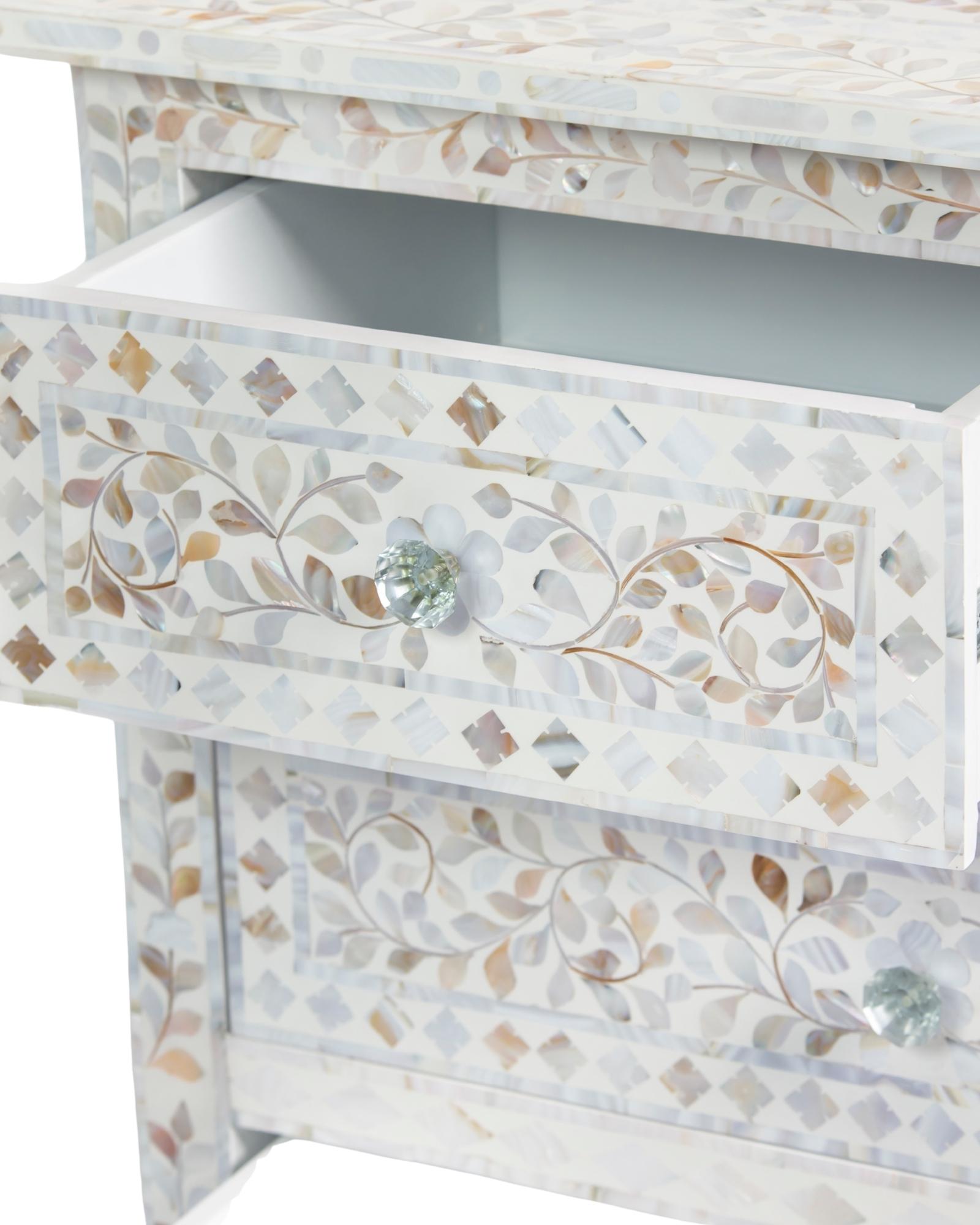 Mother of pearl inlay chest of drawers featuring intricate floral pattern in white and multitone, handcrafted furniture piece.