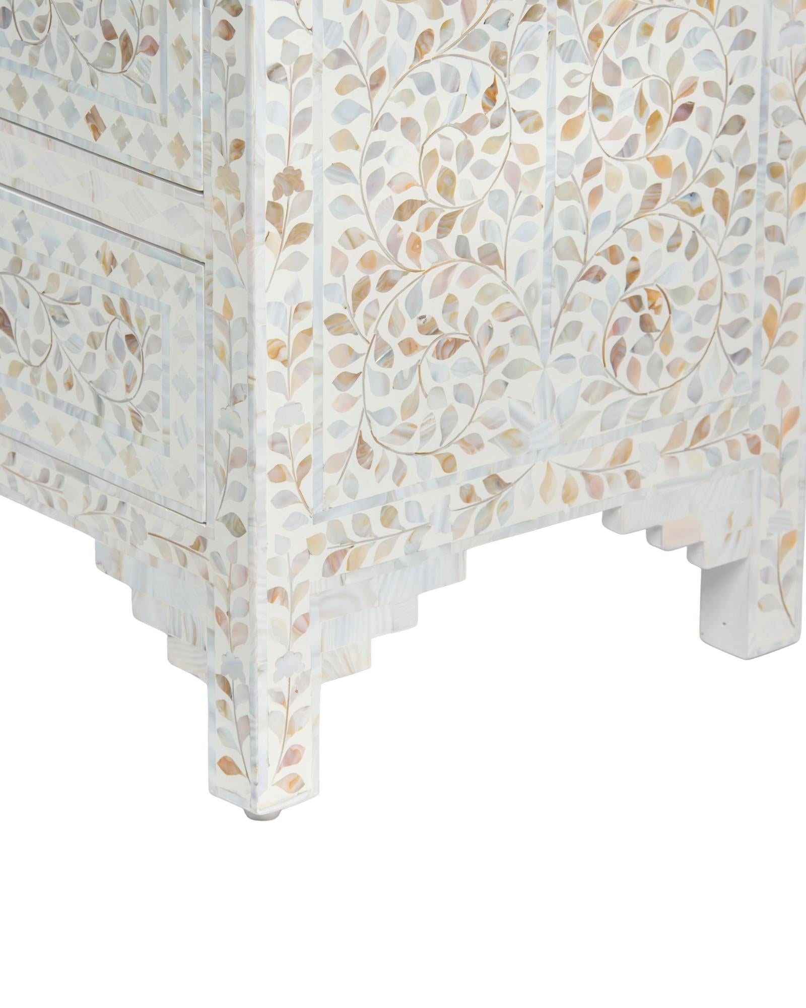 Mother of pearl inlay chest of drawers featuring intricate floral pattern in white and multitone, handcrafted furniture piece.