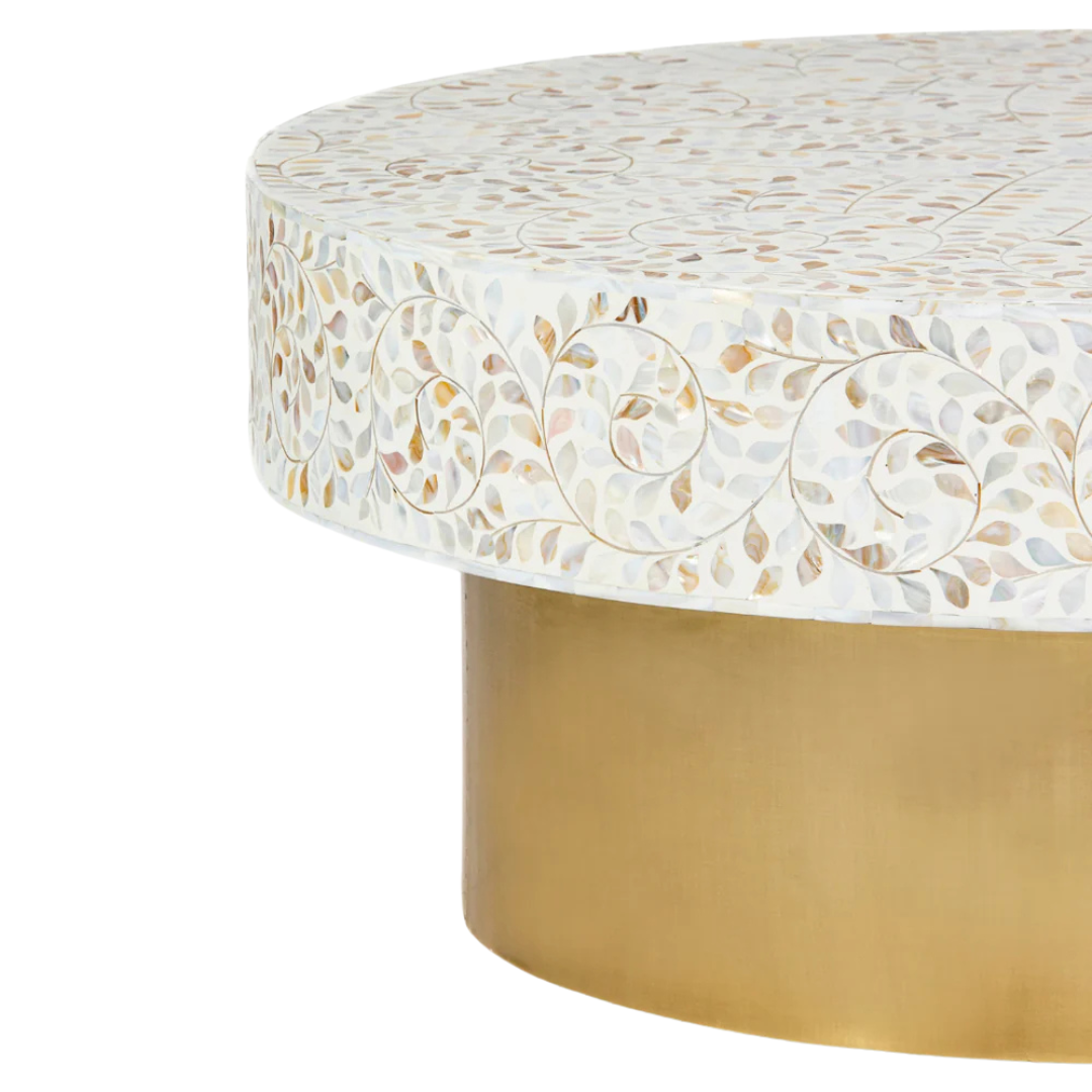 White mother of pearl inlay coffee table featuring intricate floral vine design and brushed gold cylindrical base by Tabeer Homes.
