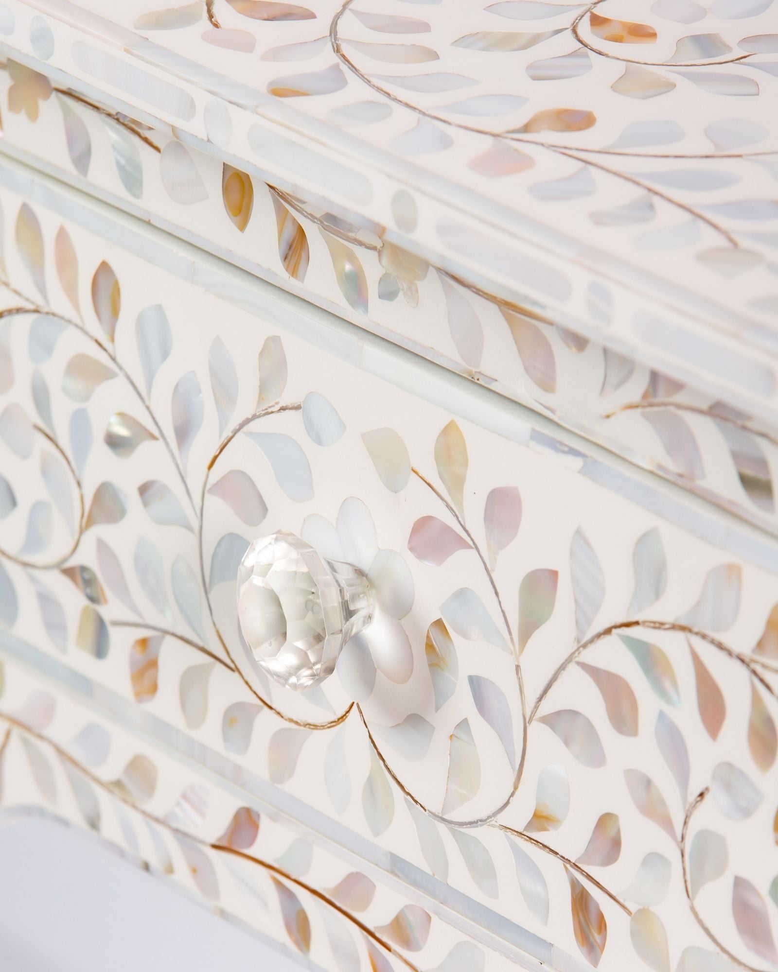 White mother of pearl inlay console with curved fully inlaid base, handcrafted with seamless iridescent detailing.