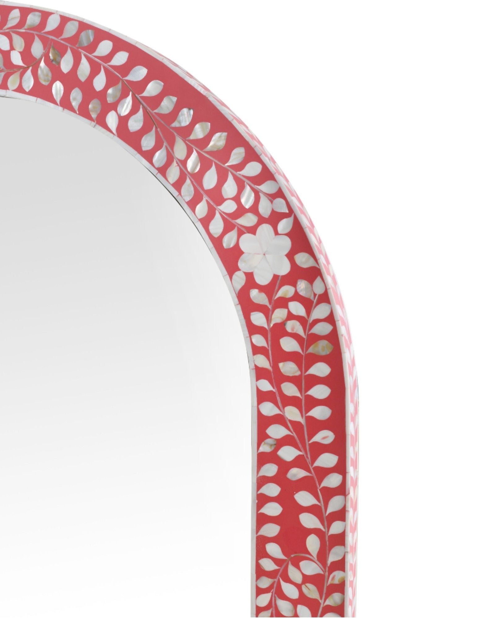 Handcrafted arched mirror with pink mother of pearl inlay, featuring intricate floral and vine detailing on a sleek frame.