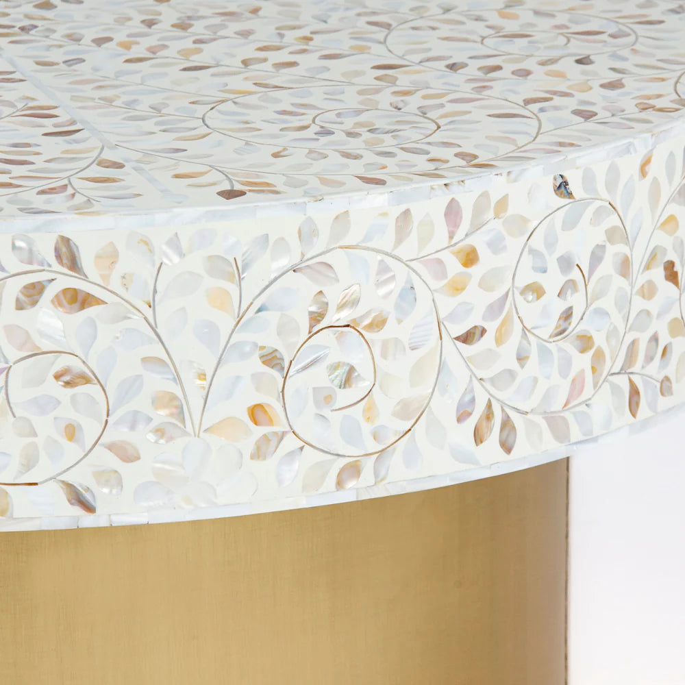 White mother of pearl inlay coffee table featuring intricate floral vine design and brushed gold cylindrical base by Tabeer Homes.