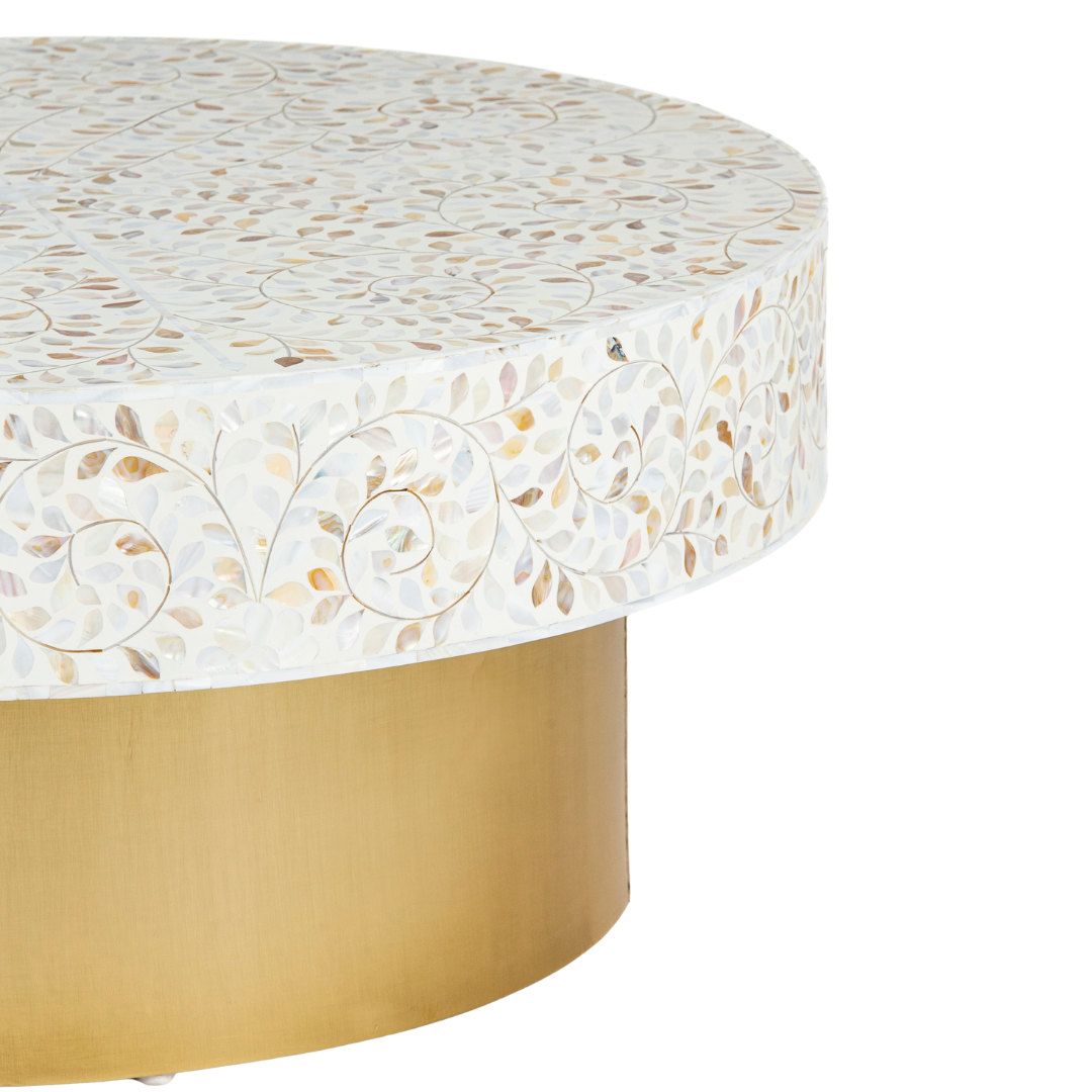 White mother of pearl inlay coffee table featuring intricate floral vine design and brushed gold cylindrical base by Tabeer Homes.