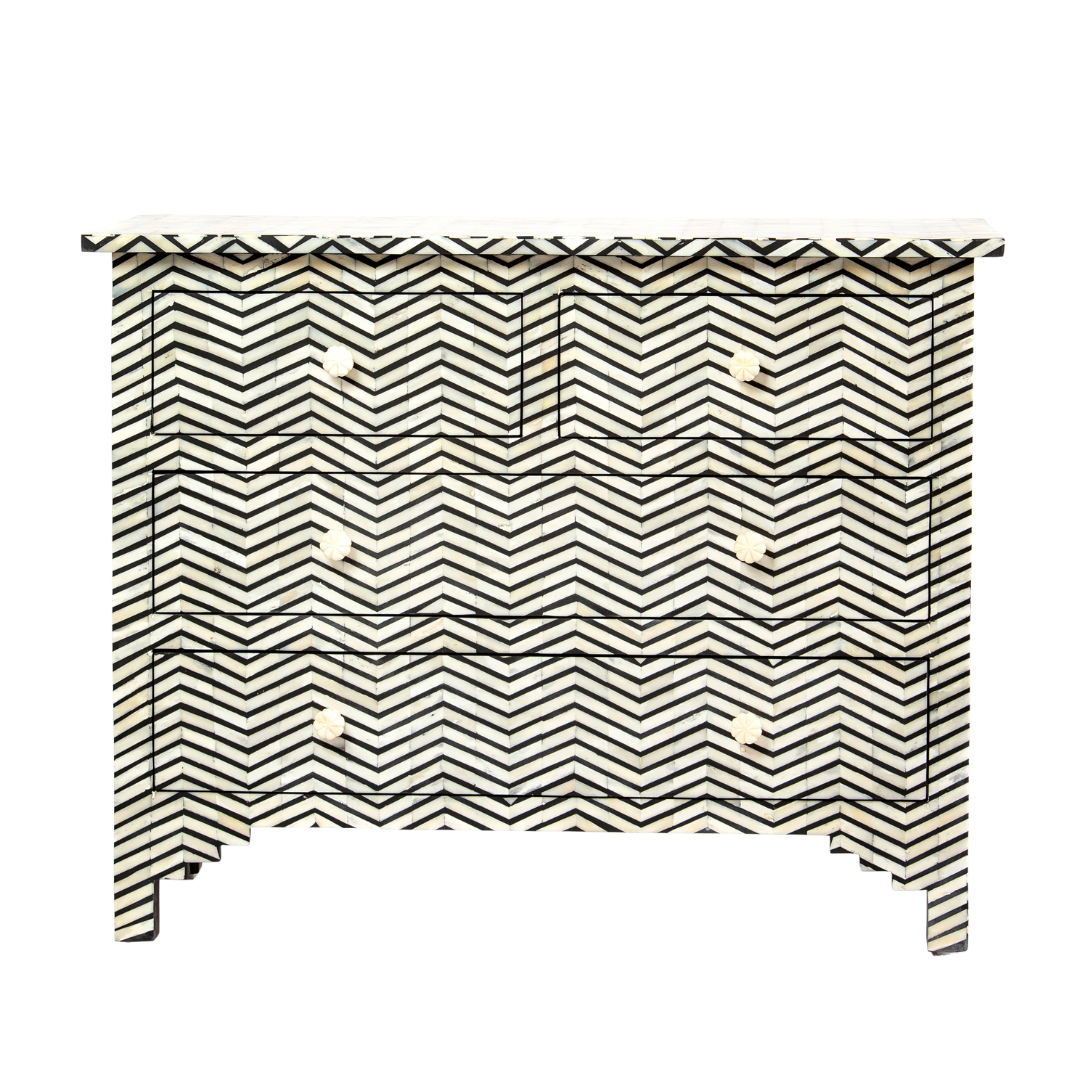Featuring a Black Bone Inlay Chest of Drawer in chevron pattern, the Isra collection enhances your space with intricately handcrafted designs that elevate your home and living aesthetics. 