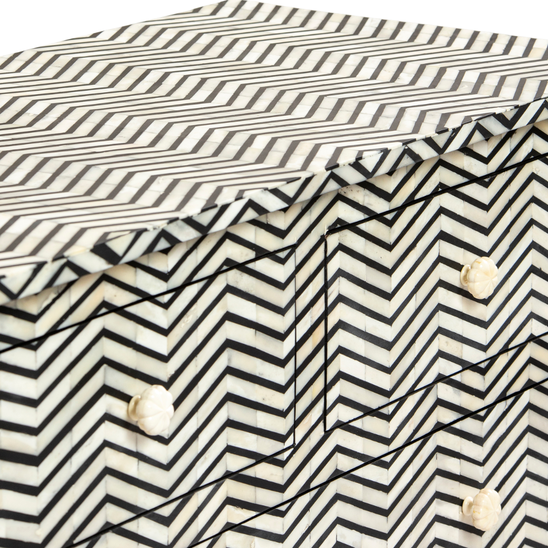 Featuring a Black Bone Inlay Chest of Drawer in chevron pattern, the Isra collection enhances your space with intricately handcrafted designs that elevate your home and living aesthetics. 