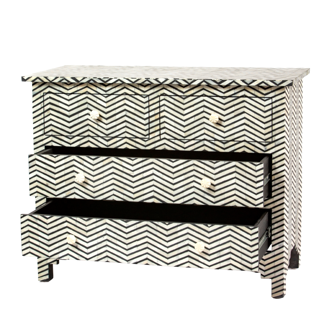 Featuring a Black Bone Inlay Chest of Drawer in chevron pattern, the Isra collection enhances your space with intricately handcrafted designs that elevate your home and living aesthetics. 