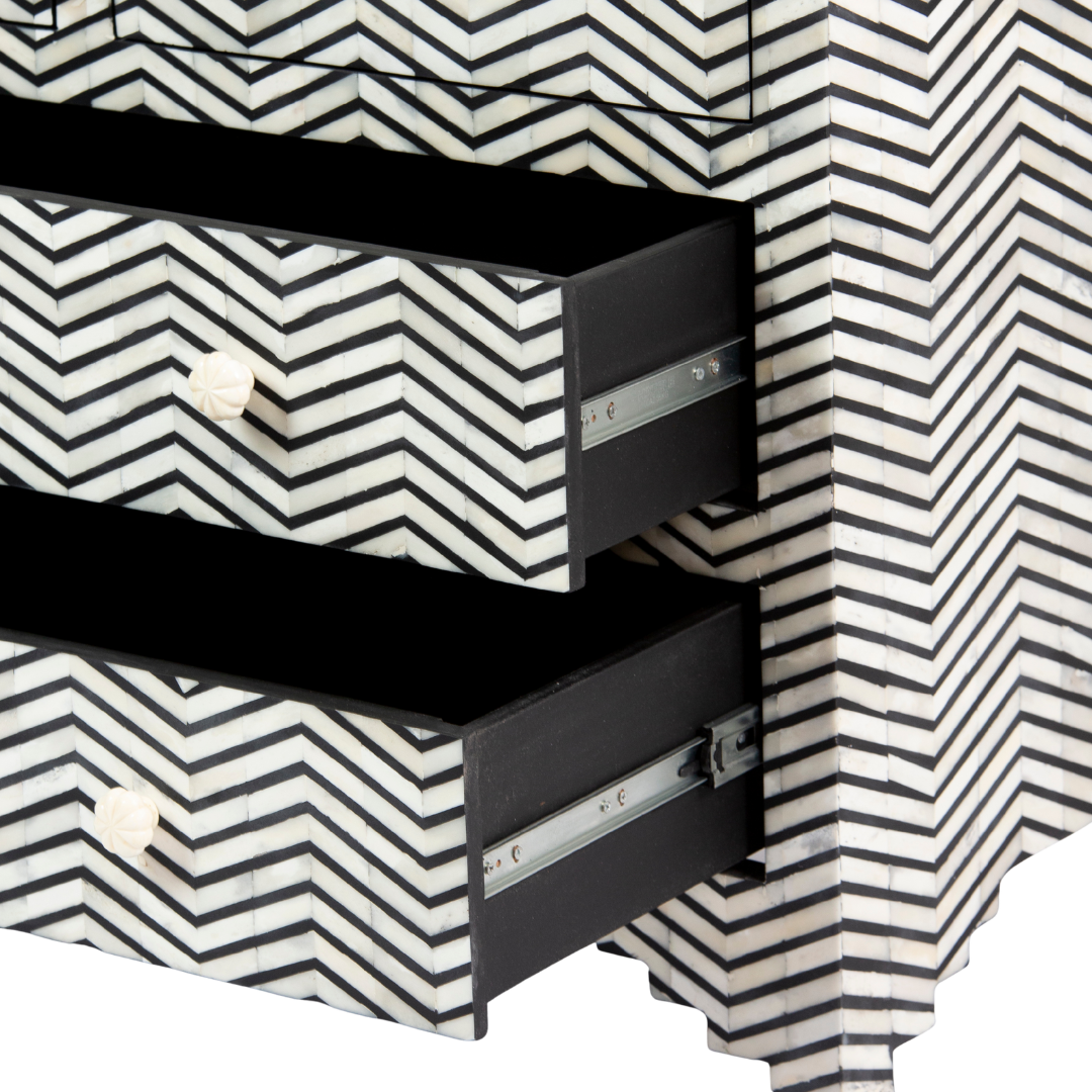 Featuring a Black Bone Inlay Chest of Drawer in chevron pattern, the Isra collection enhances your space with intricately handcrafted designs that elevate your home and living aesthetics. 