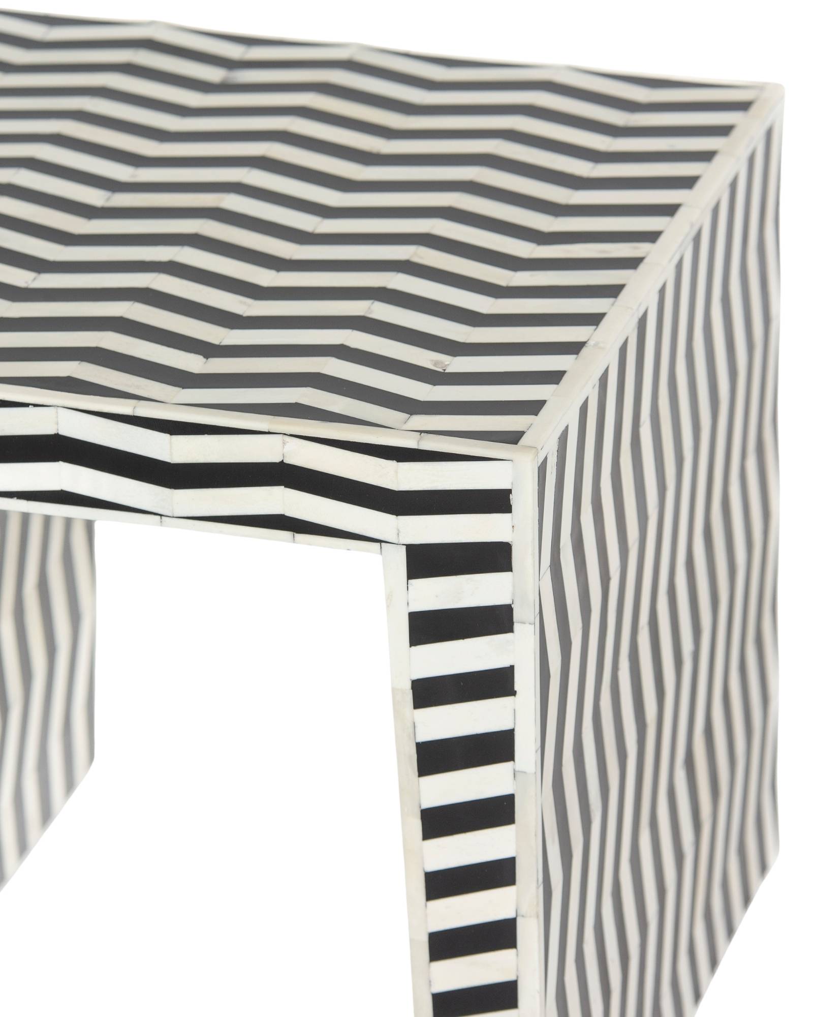 Handcrafted Isra side table featuring black bone inlay with geometric striped detailing and a compact cubic form.