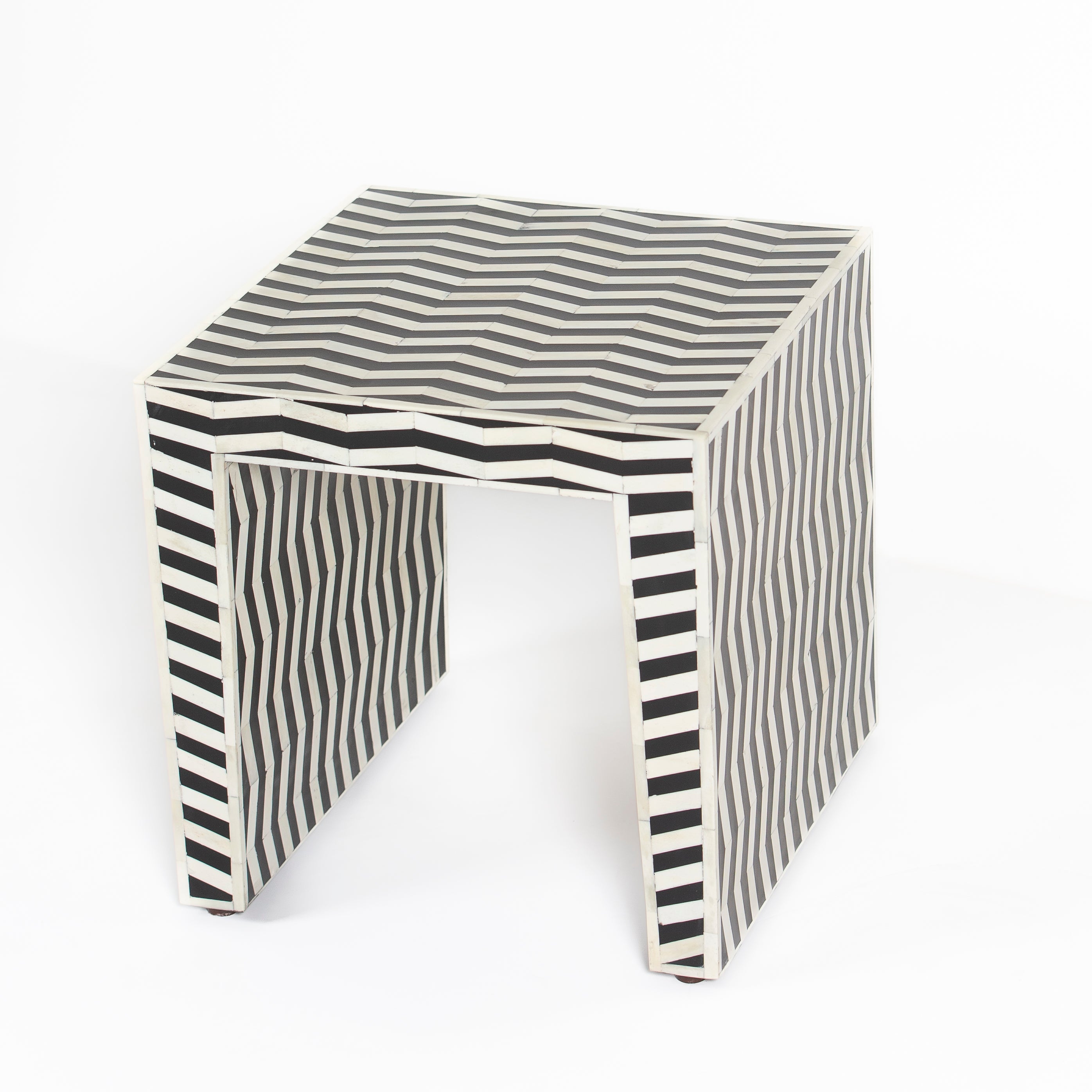 Handcrafted Isra side table featuring black bone inlay with geometric striped detailing and a compact cubic form.