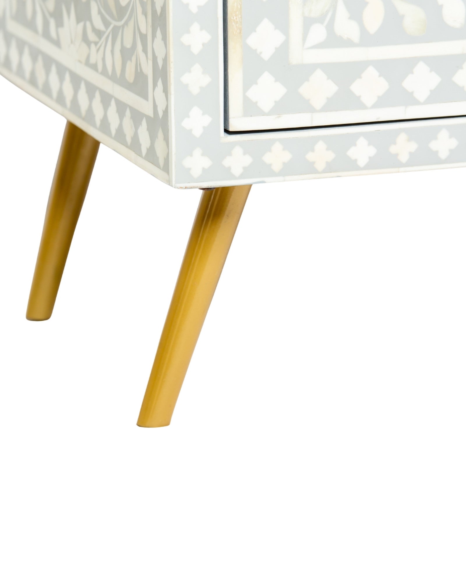 Grey bone inlay cabinet with floral vine pattern, brass legs, and carved bone knobs, handcrafted with spacious storage and artisanal charm.