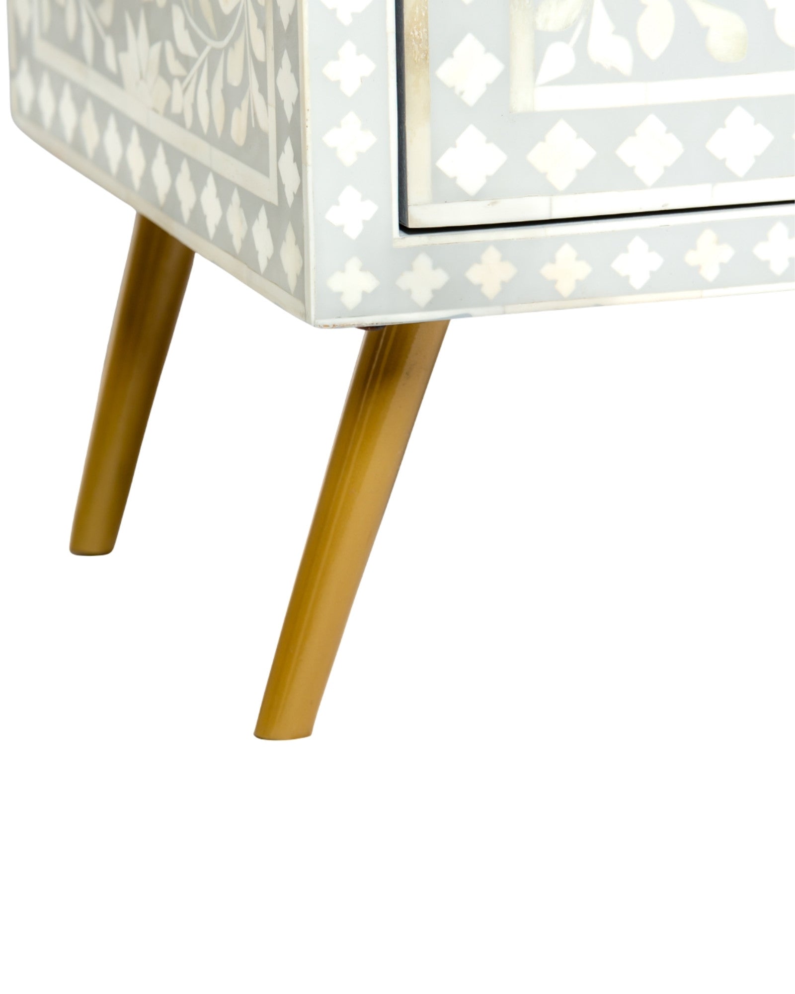 Grey bone inlay cabinet with floral vine pattern, brass legs, and carved bone knobs, handcrafted with spacious storage and artisanal charm.