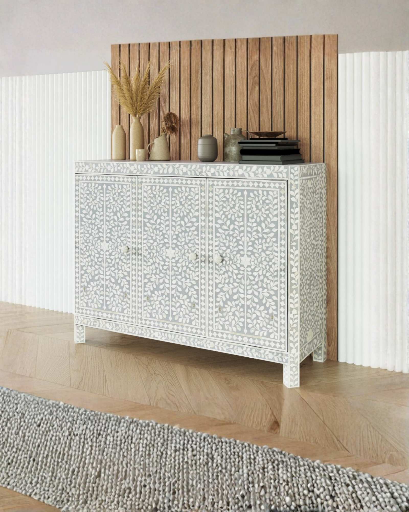 Handcrafted grey Cabinet with intricate Bone inlay, featuring a floral pattern and sleek Bone legs. A luxurious storage solution for any space. 