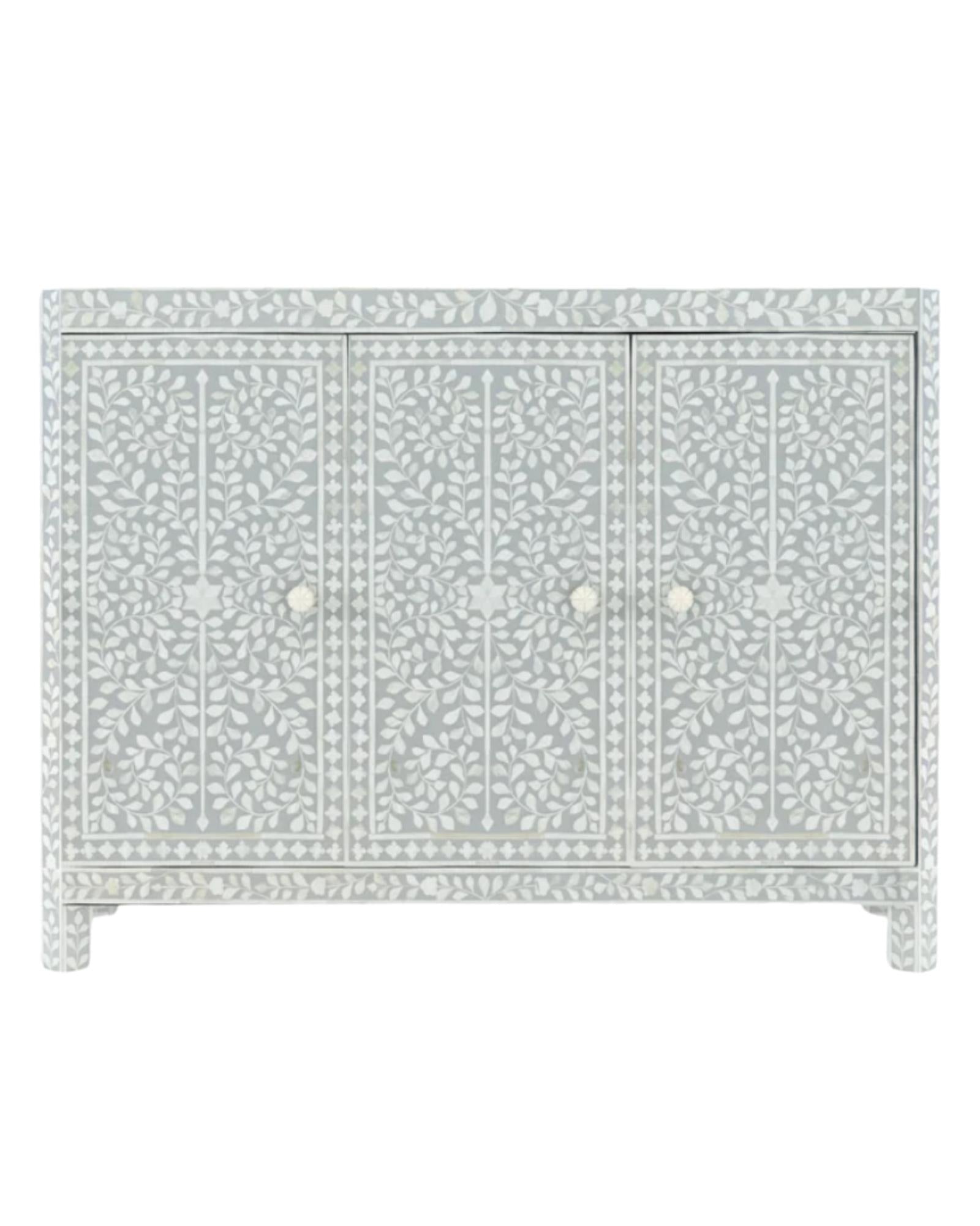 Handcrafted grey Cabinet with intricate Bone inlay, featuring a floral pattern and sleek Bone legs. A luxurious storage solution for any space. 