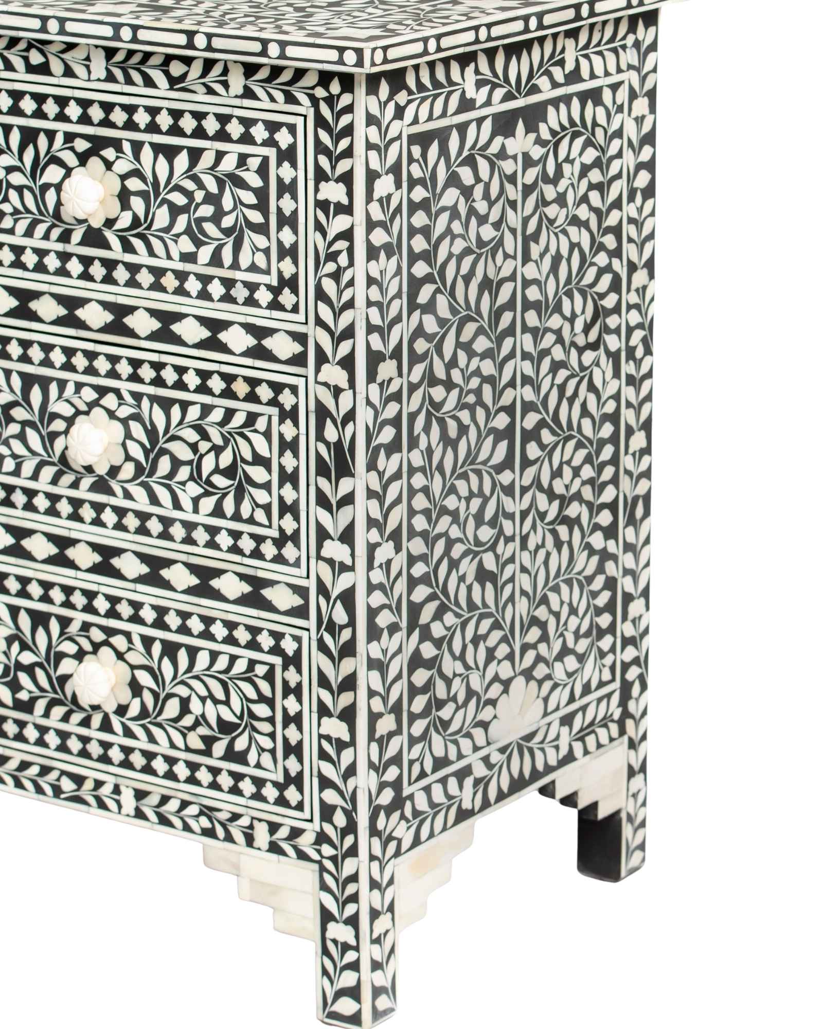 Bone inlay chest of drawers featuring intricate floral pattern in black and white, handcrafted furniture piece.