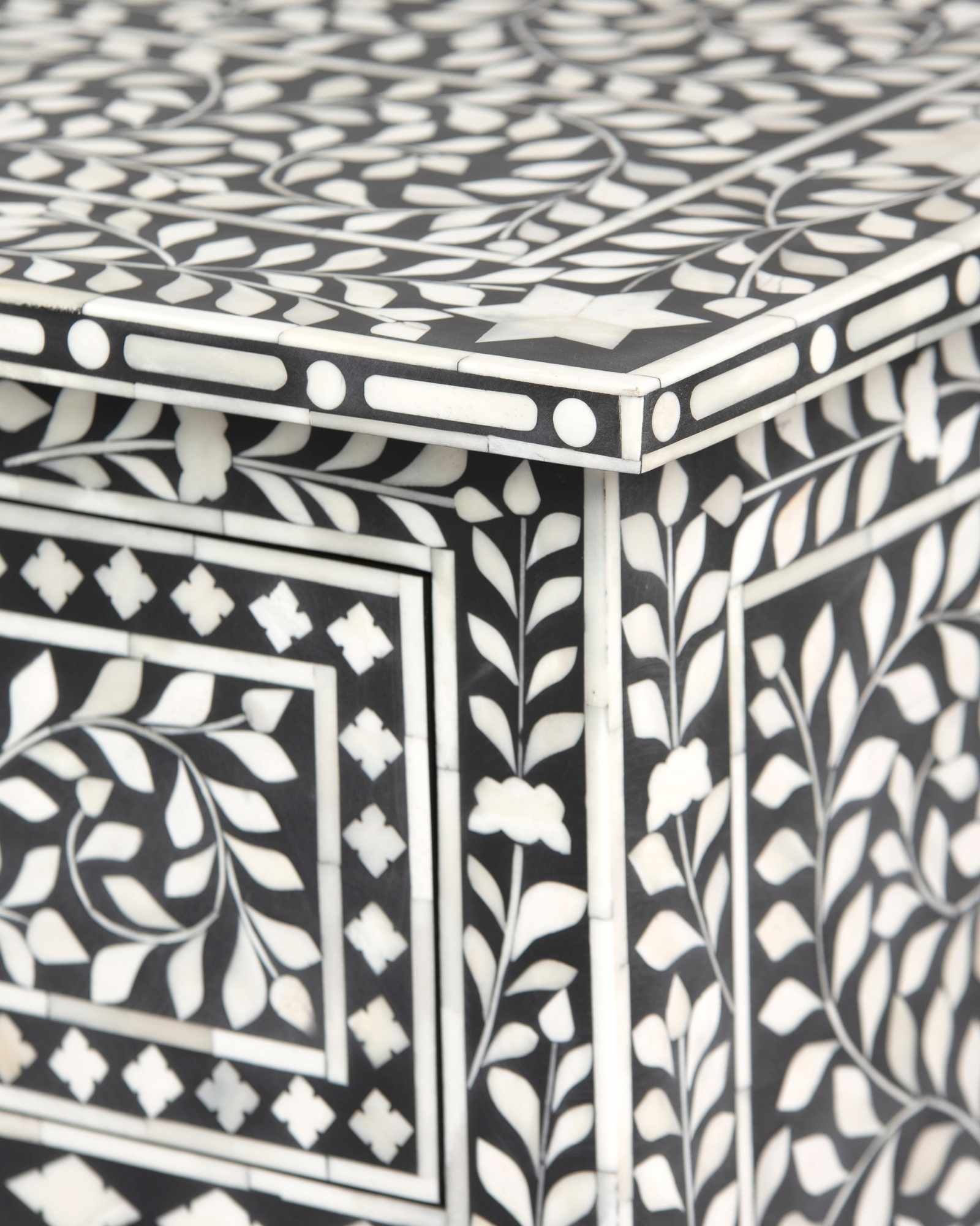 Bone inlay chest of drawers featuring intricate floral pattern in black and white, handcrafted furniture piece.