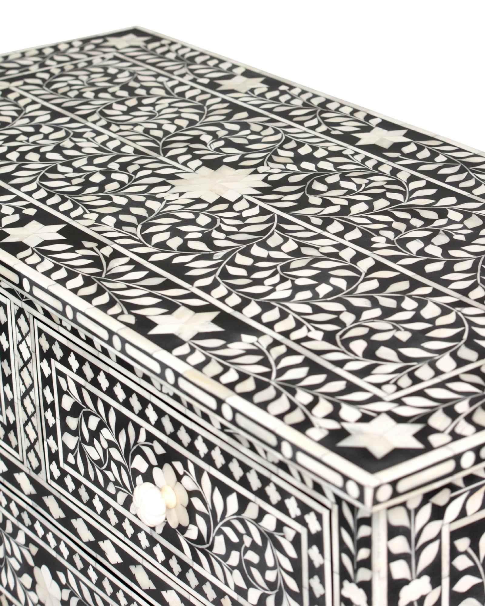Bone inlay chest of drawers featuring intricate floral pattern in black and white, handcrafted furniture piece.