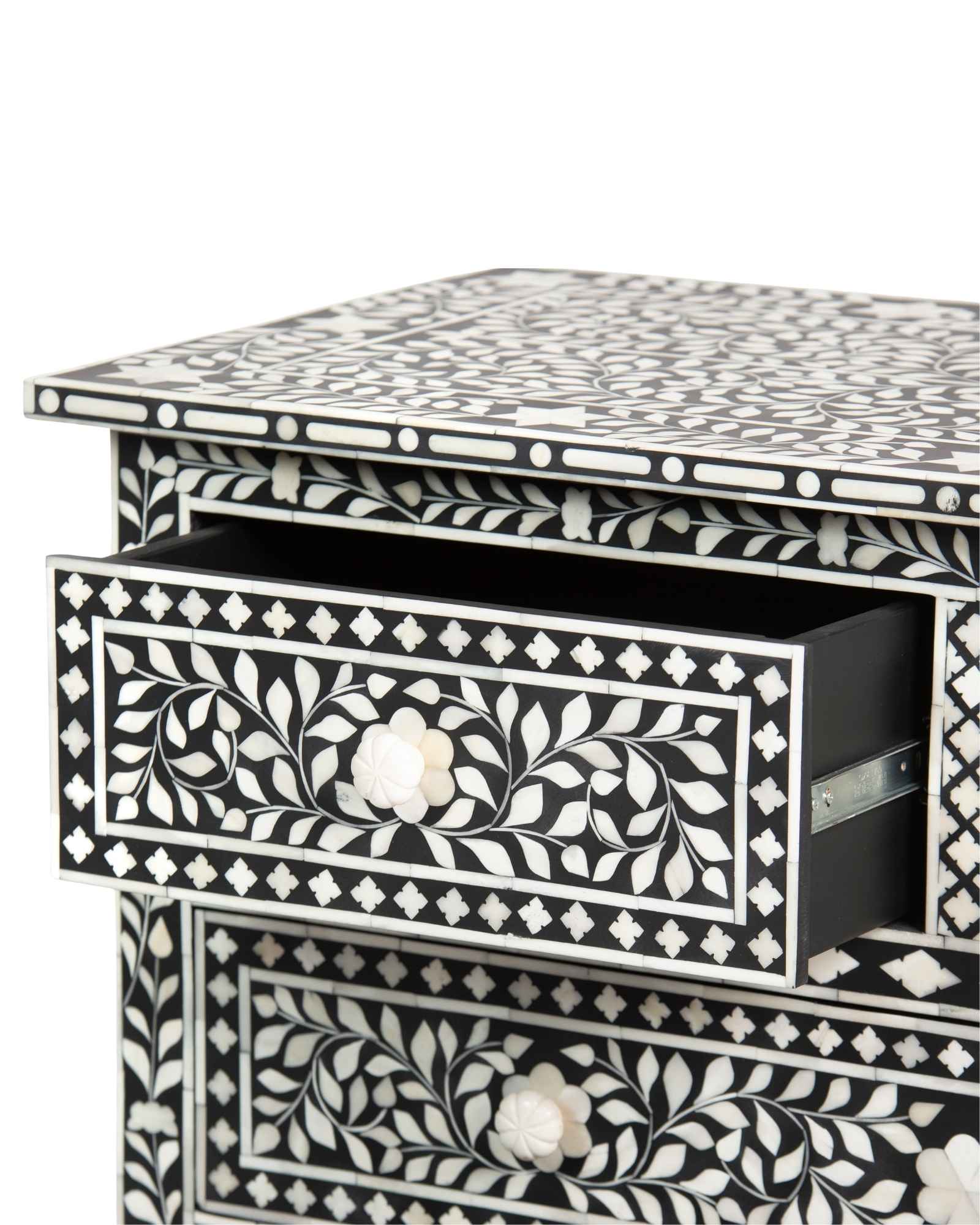 Bone inlay chest of drawers featuring intricate floral pattern in black and white, handcrafted furniture piece.