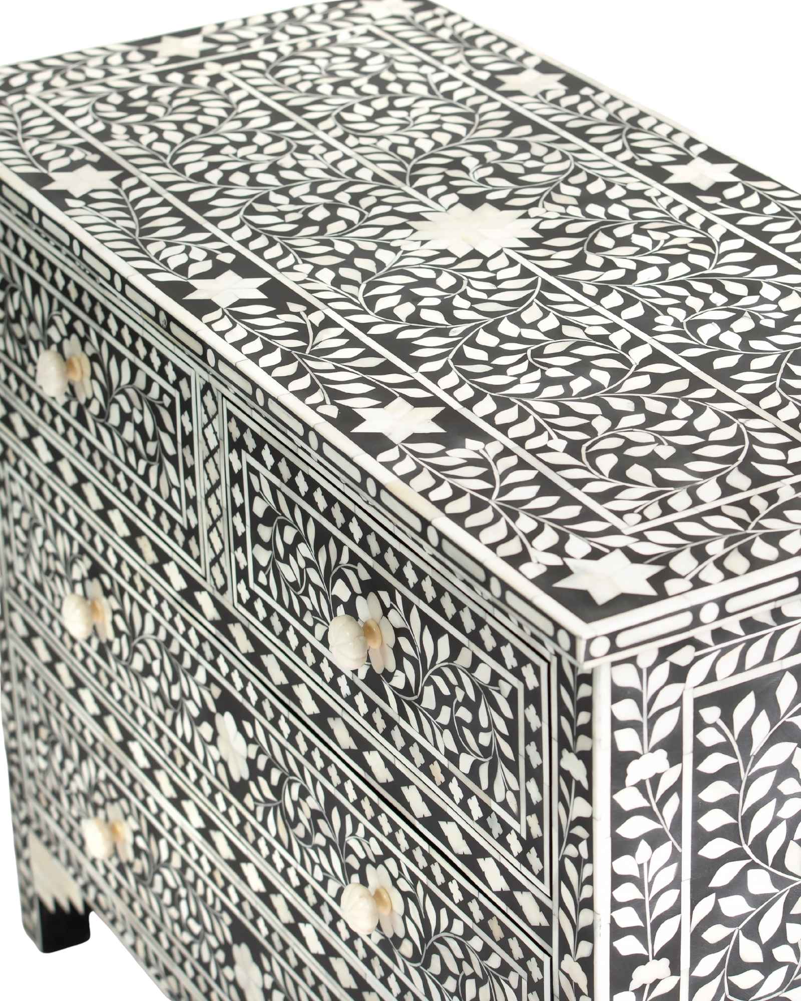 Bone inlay chest of drawers featuring intricate floral pattern in black and white, handcrafted furniture piece.