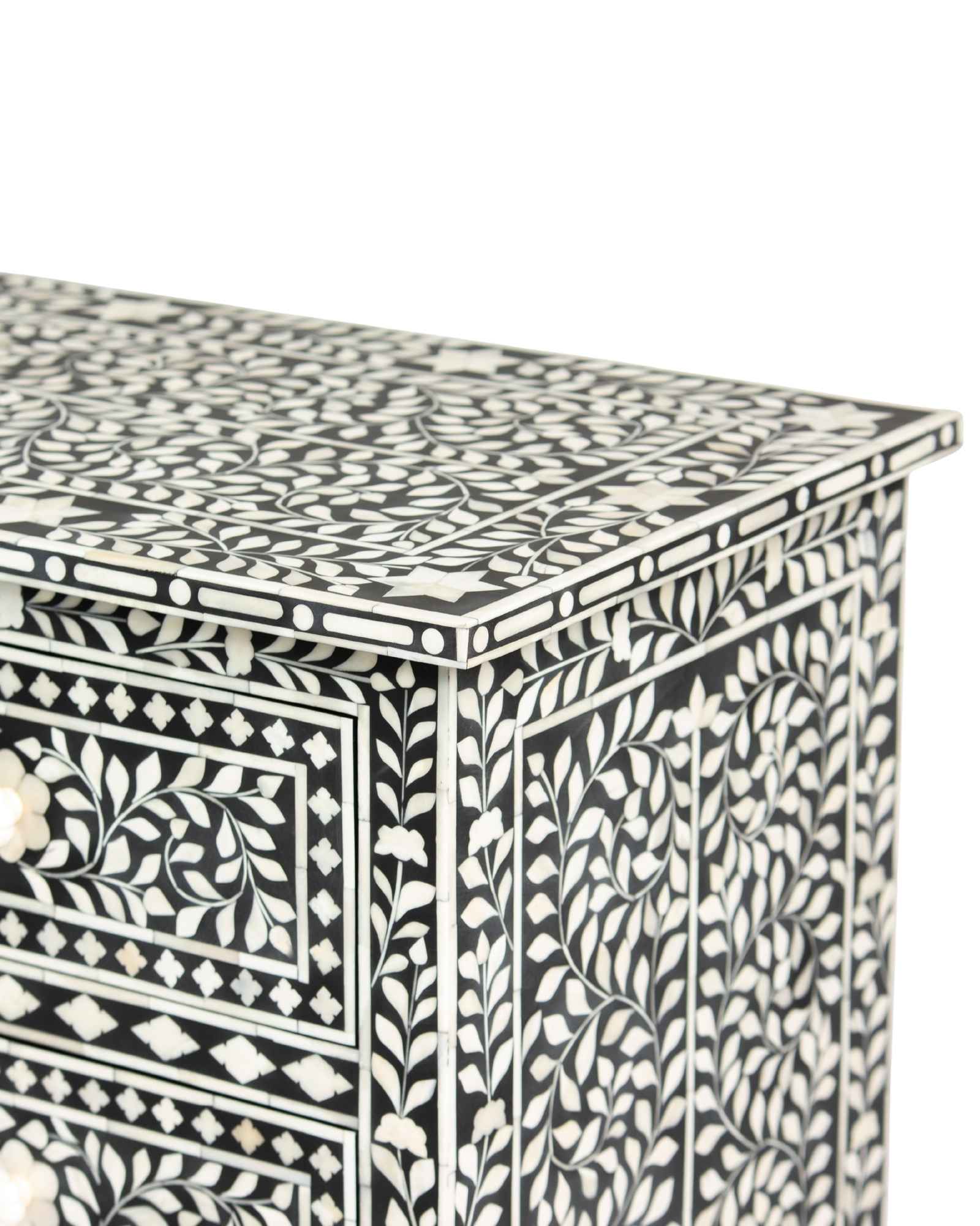 Bone inlay chest of drawers featuring intricate floral pattern in black and white, handcrafted furniture piece.