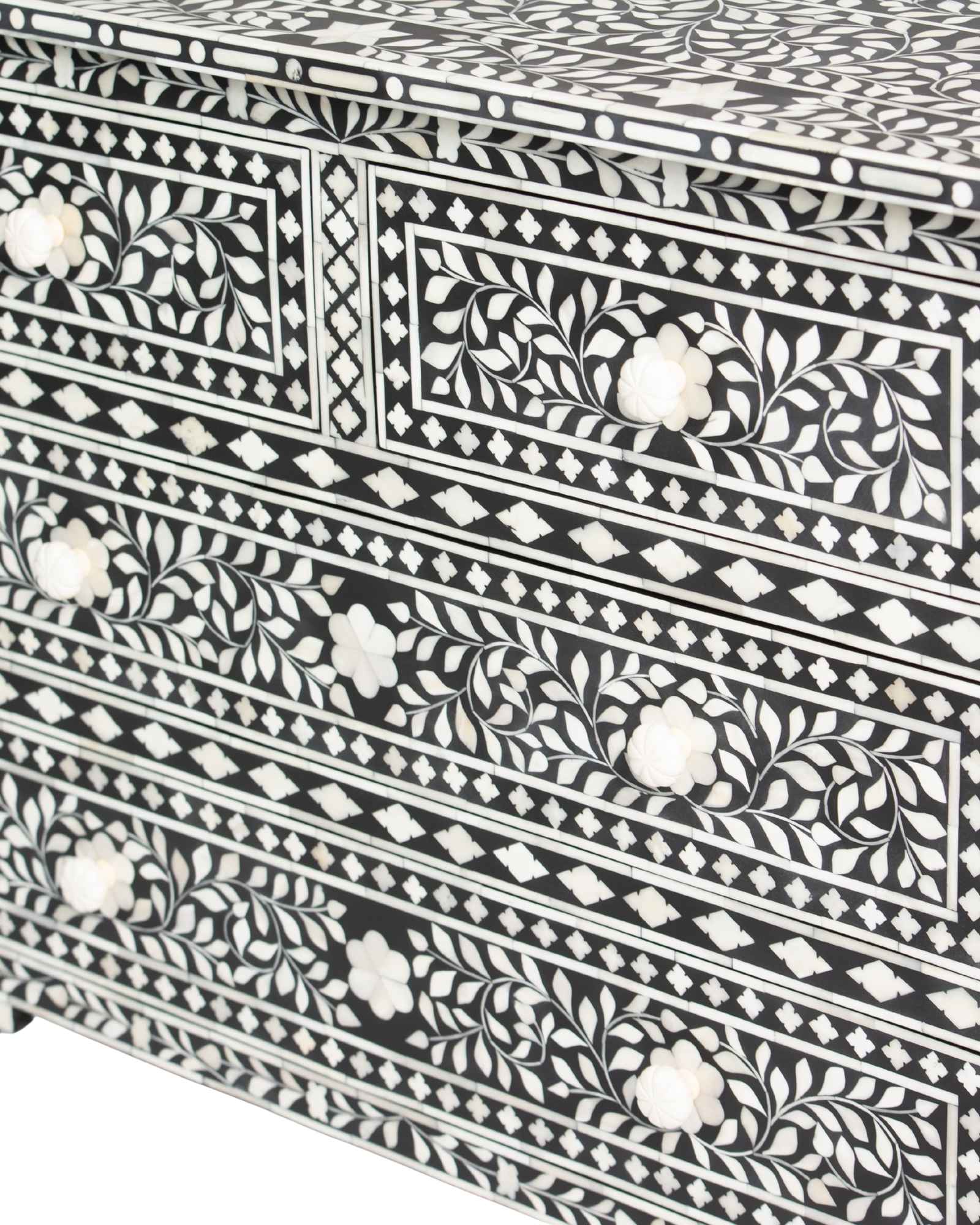 Bone inlay chest of drawers featuring intricate floral pattern in black and white, handcrafted furniture piece.